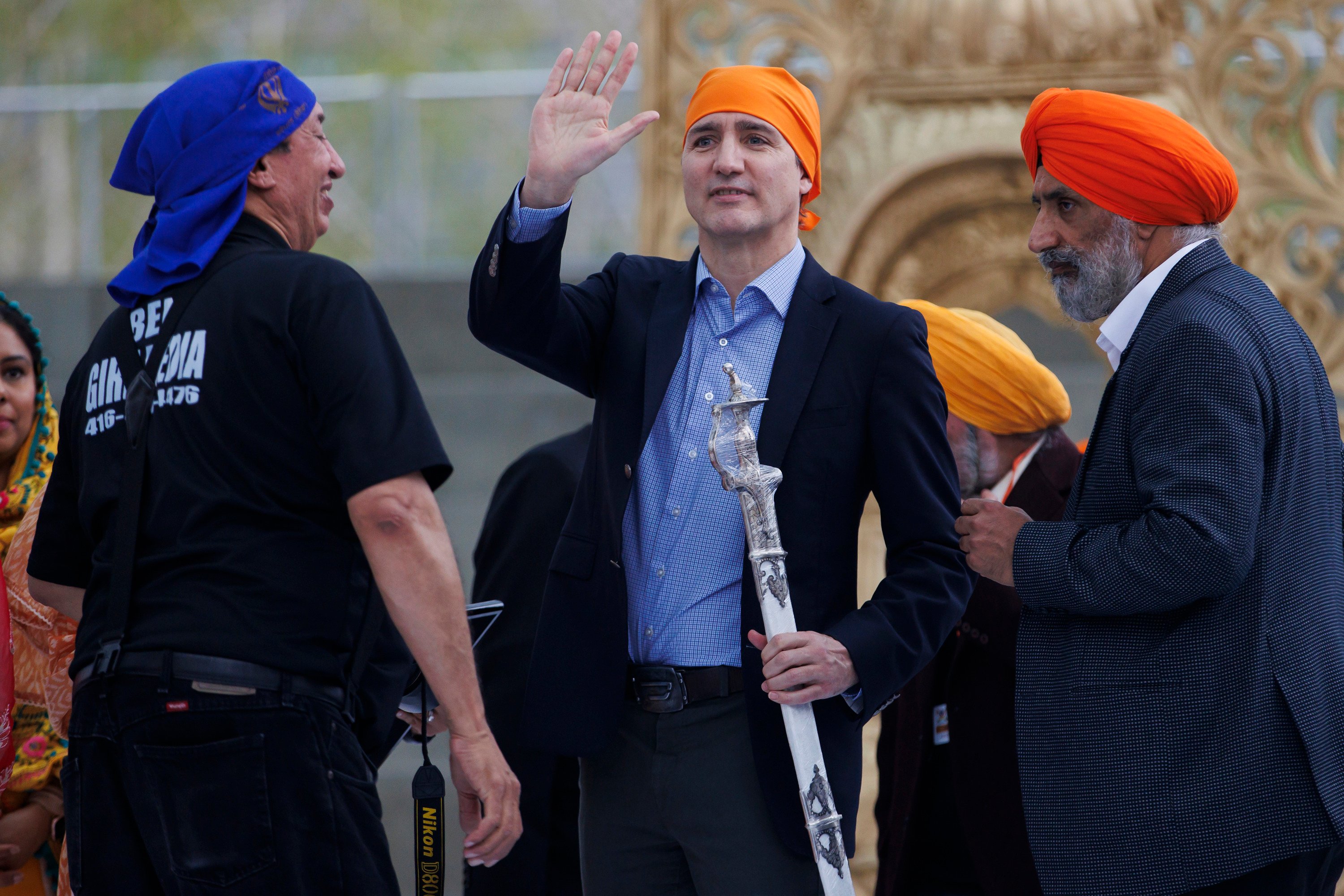 Canadian Prime Minister Justin Trudeau (centre) waves to the crowd after receiving a ceremonial sword as a gift from the Ontario Sikhs and Gurudwara Council on April 28. Photo: The Canadian Press via AP