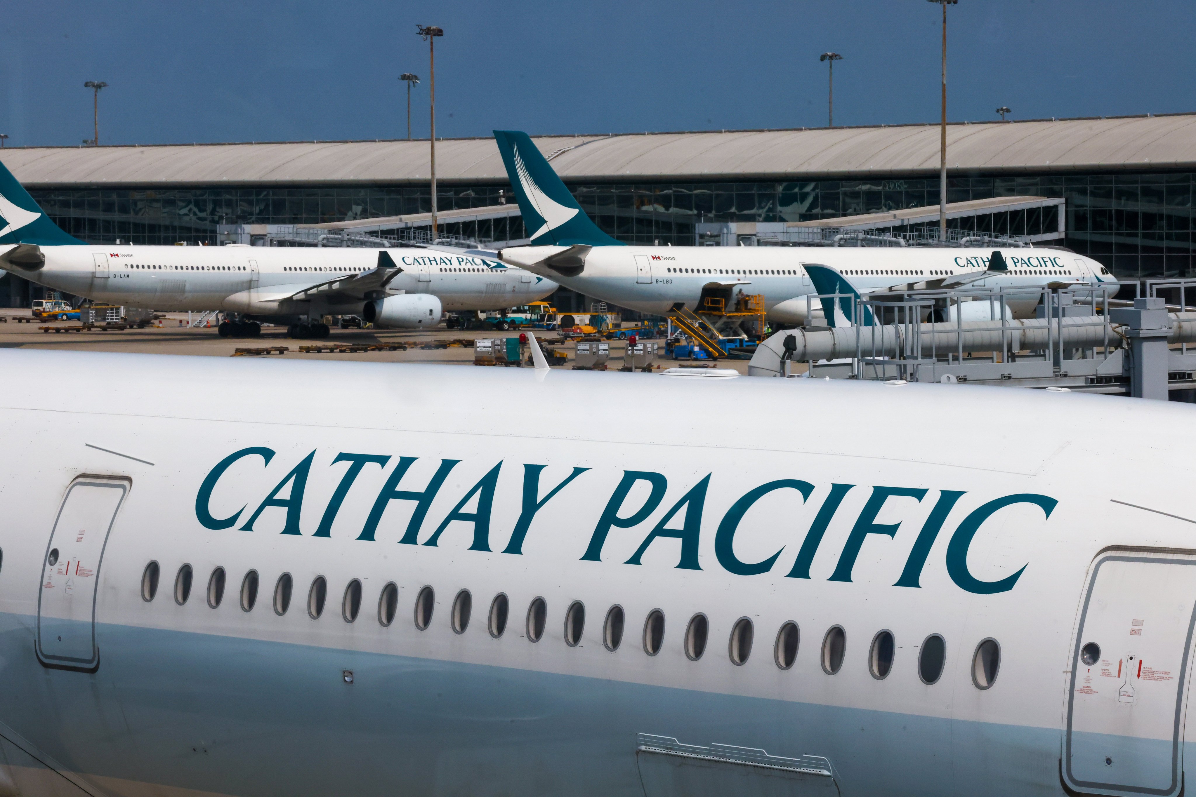 Cathay planes at Hong Kong International Airport. An Airport Authority spokesman said heavy rain and strong winds resulted in 61 incoming and 33 outgoing flights being delayed on Tuesday night. Photo: Jonathan Wong