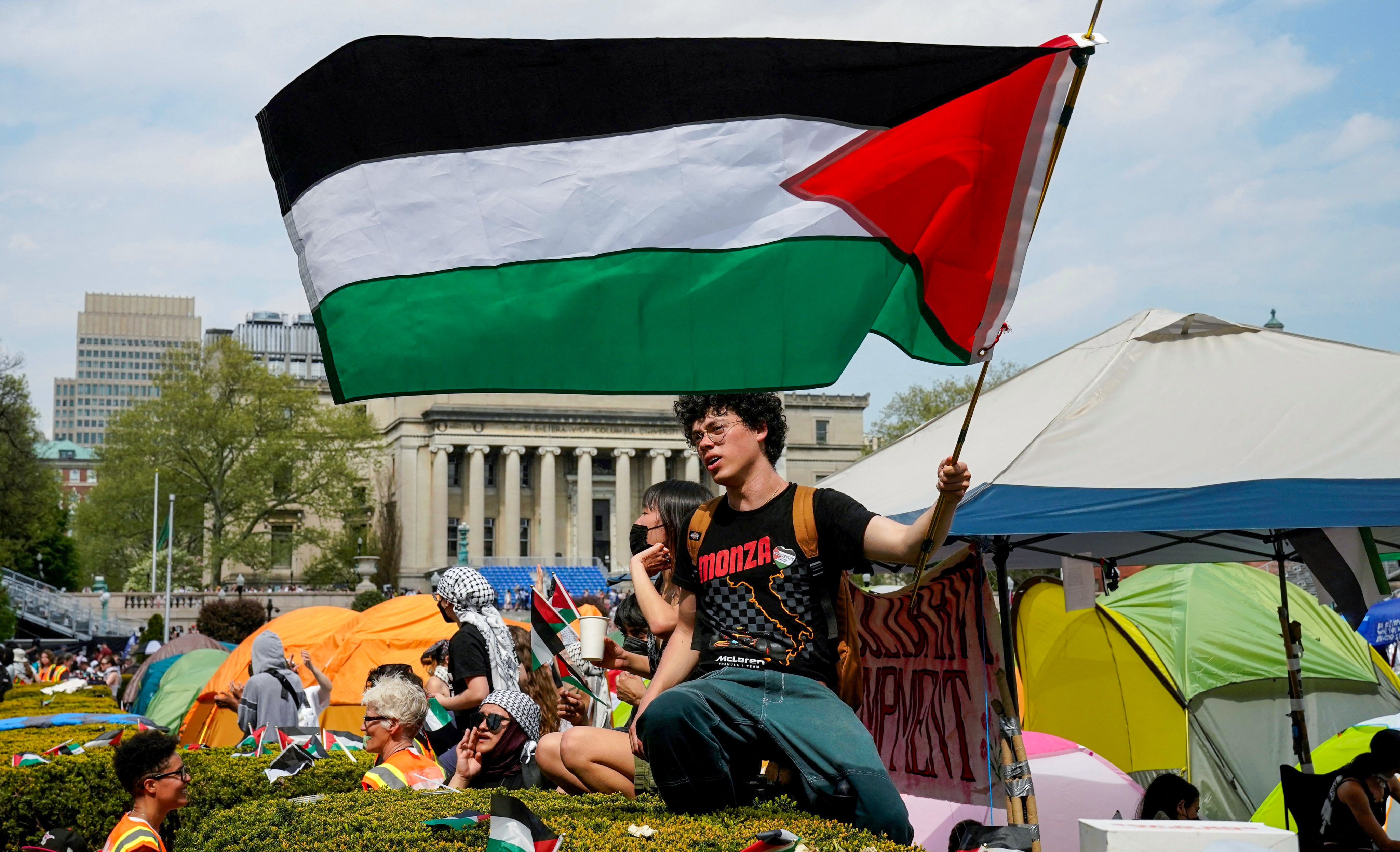 A protester waves a Palestinian flag on the West Lawn of Columbia University on April 29, 2024. Photo: AFP