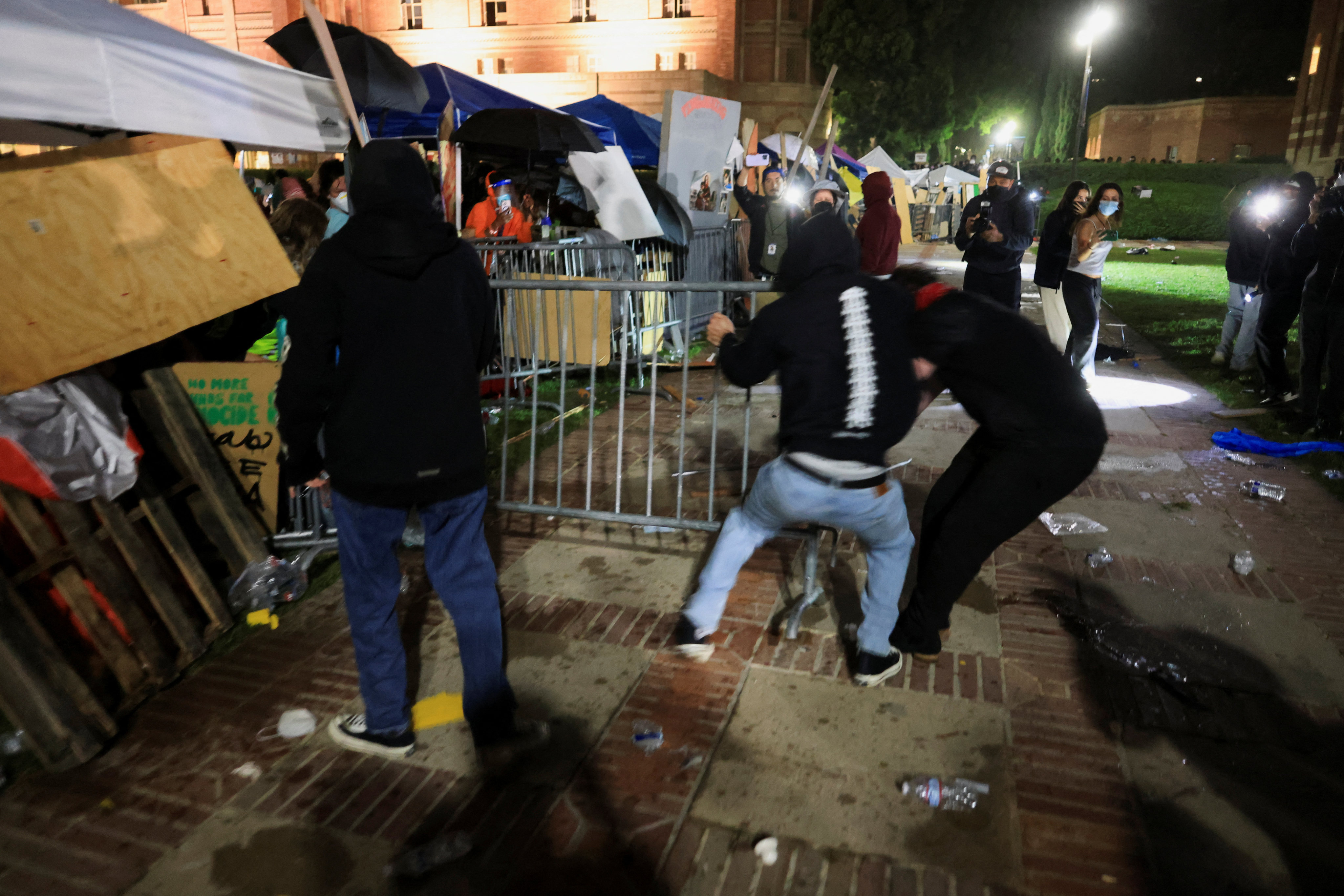 Counterprotesters attempt to move a barricade at an encampment on the campus of the University of California Los Angeles (UCLA). Photo: Reuters