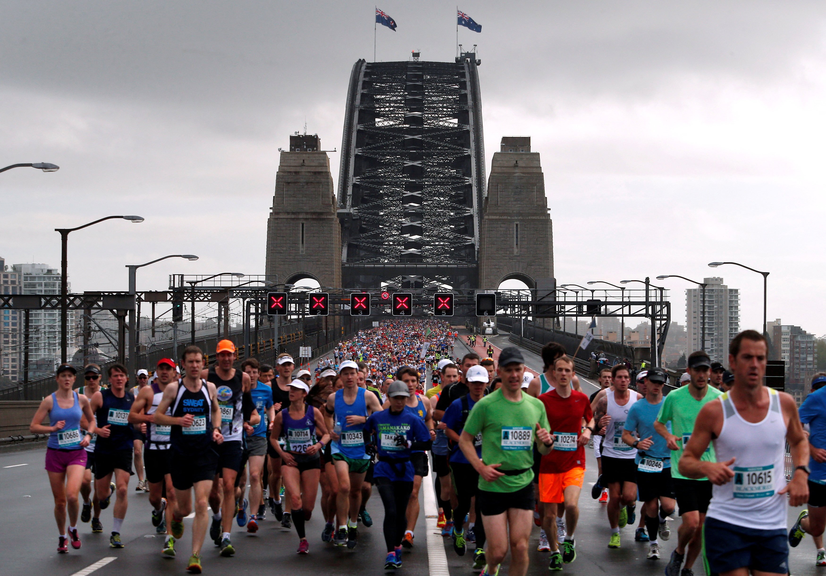 Competitors run across the Sydney Harbour Bridge during the Sydney marathon. Photo: Reuters