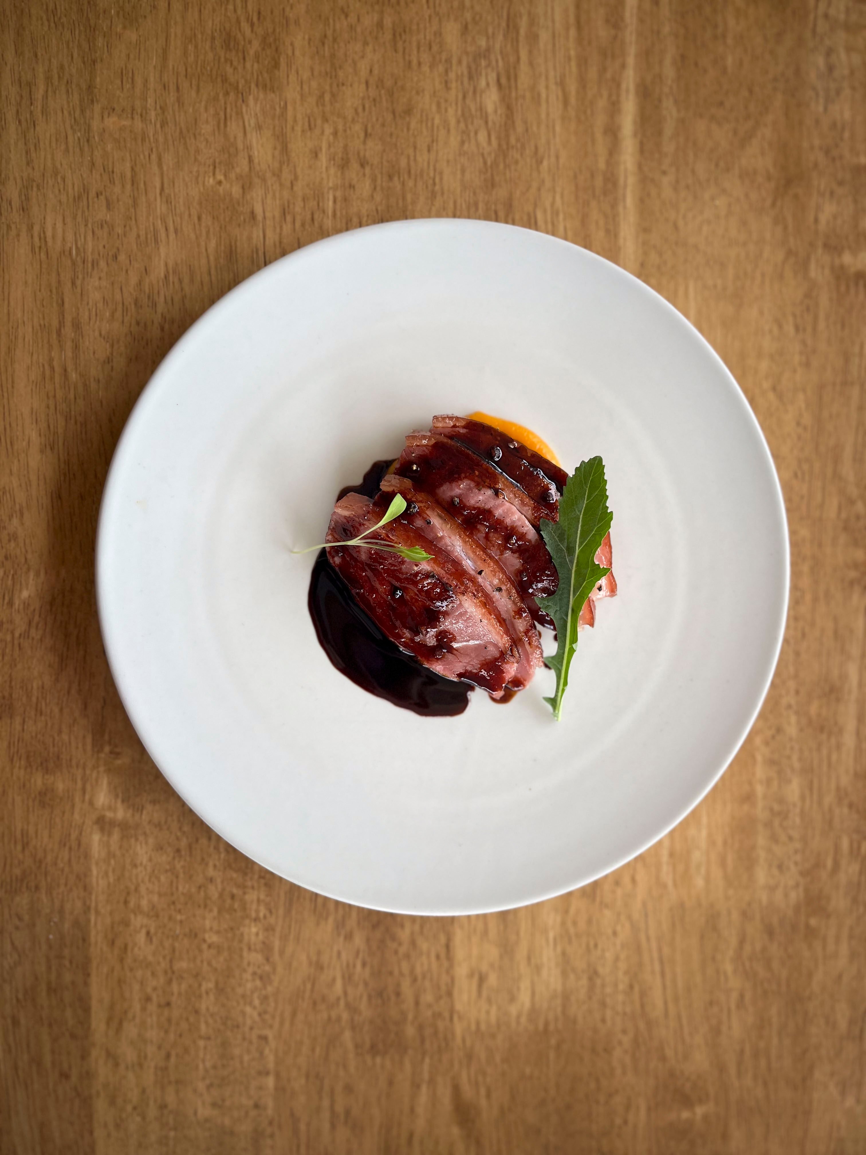 Palate’s duck aged for 2-3 weeks smoked with apple wood, cooked over charcoal, carrot puree and gastric sauce in Busan, South Korea. Photo: Charmaine Mok