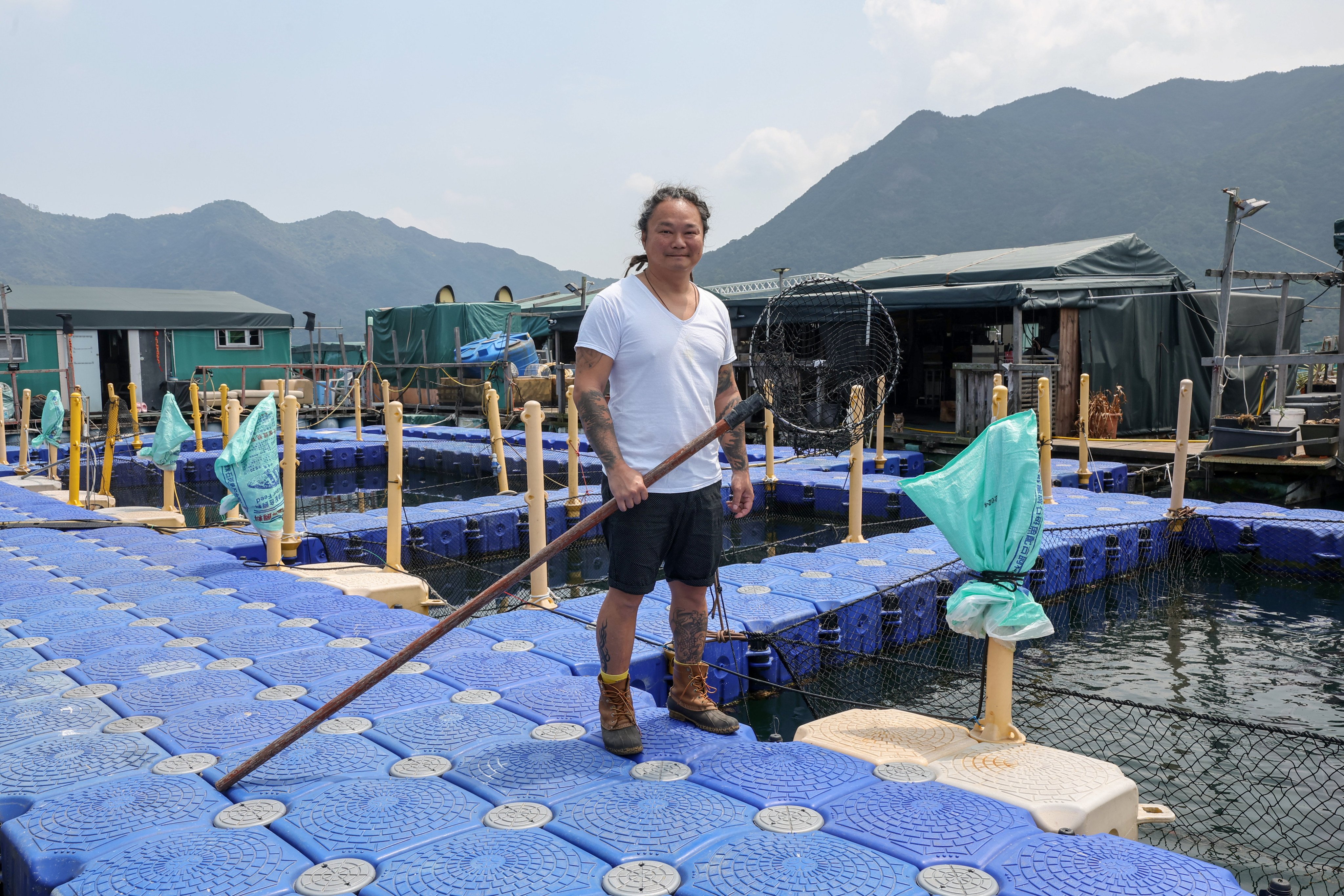 Alex Lam Tsz-lung, owner of Hong Kong Aquaculture, poses for a picture at his mariculture farm at Yung Shue O in Sai Kung. Photo: Edmond So