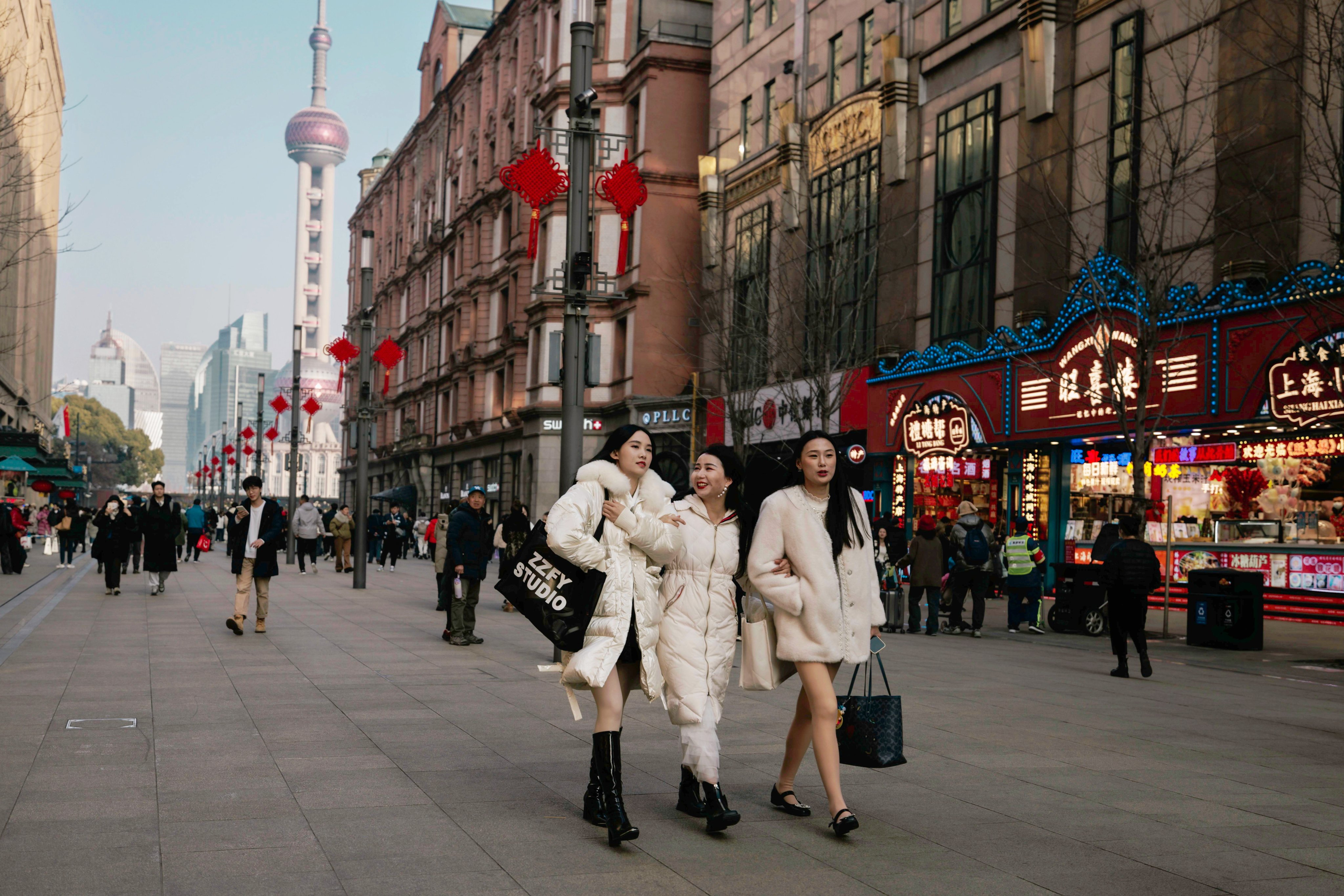 People walk along Nanjing Street, Shanghai’s main tourist and shopping street, on January 11. Photo: EPA-EFE