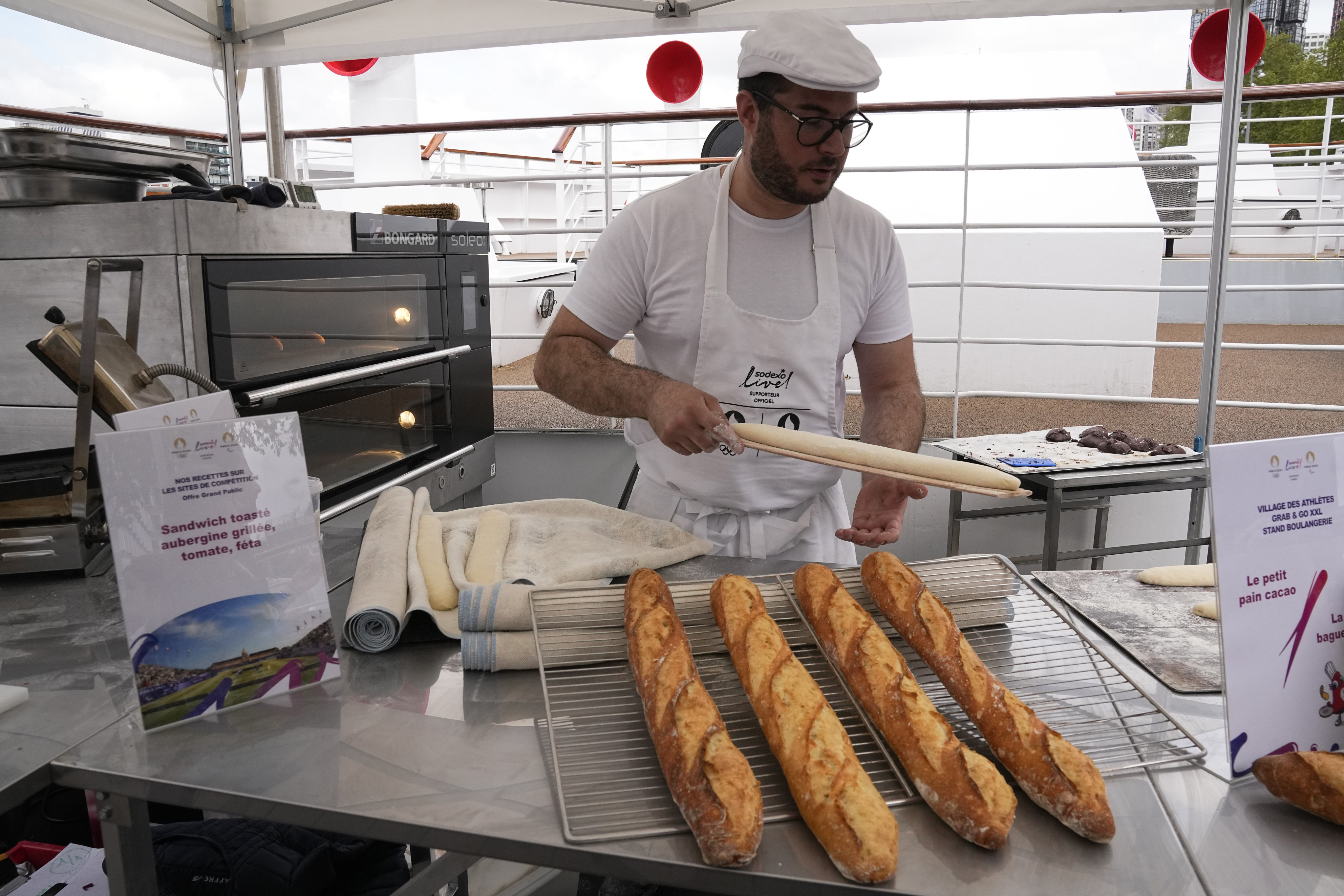 French baker Tony Dore prepares baguettes like those that will be served during the Olympic Games in Paris. Photo: AP