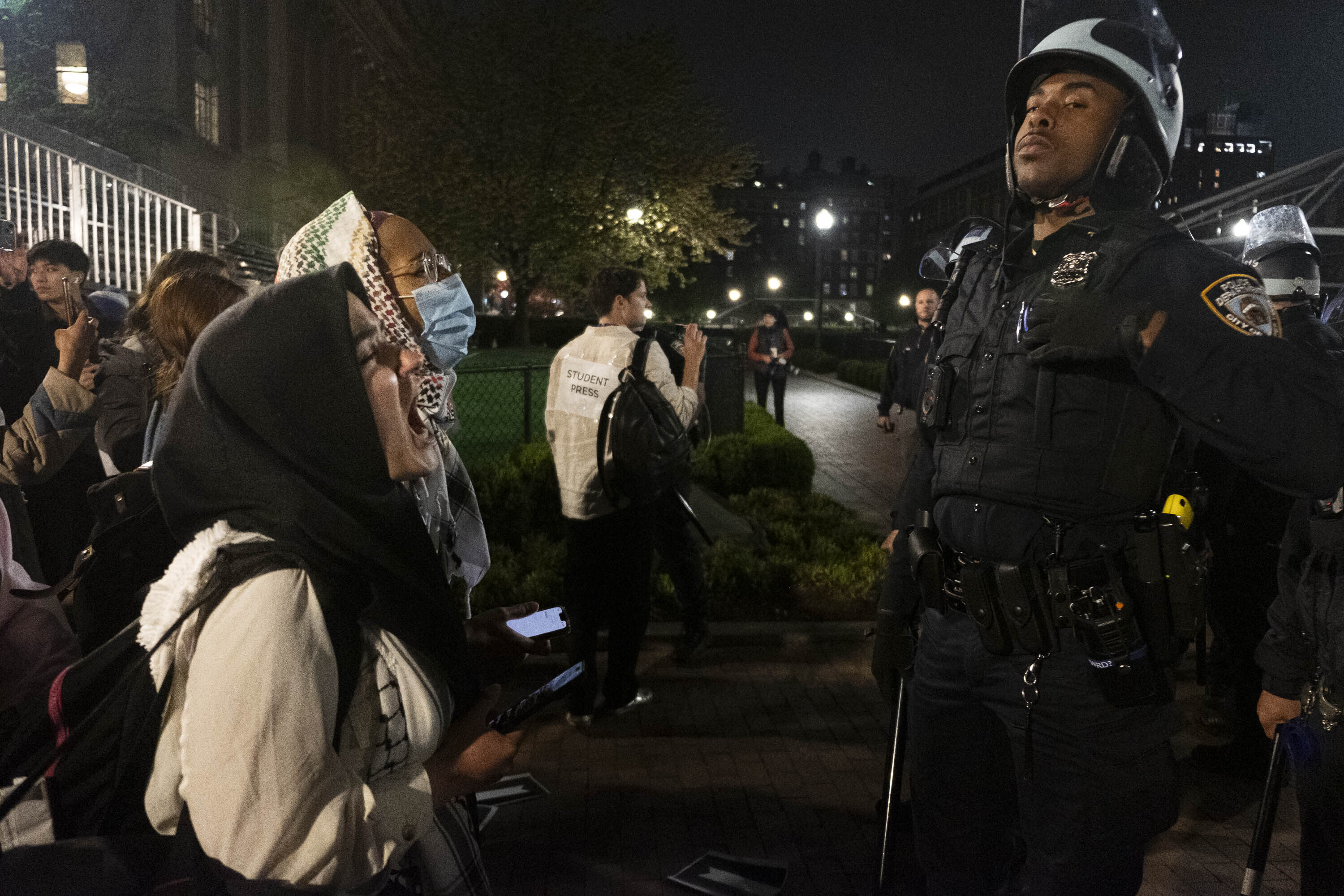 Pro-Palestine student activists face off with police officers during a raid on Columbia University’s campus in New York on April 30. Photo: AP
