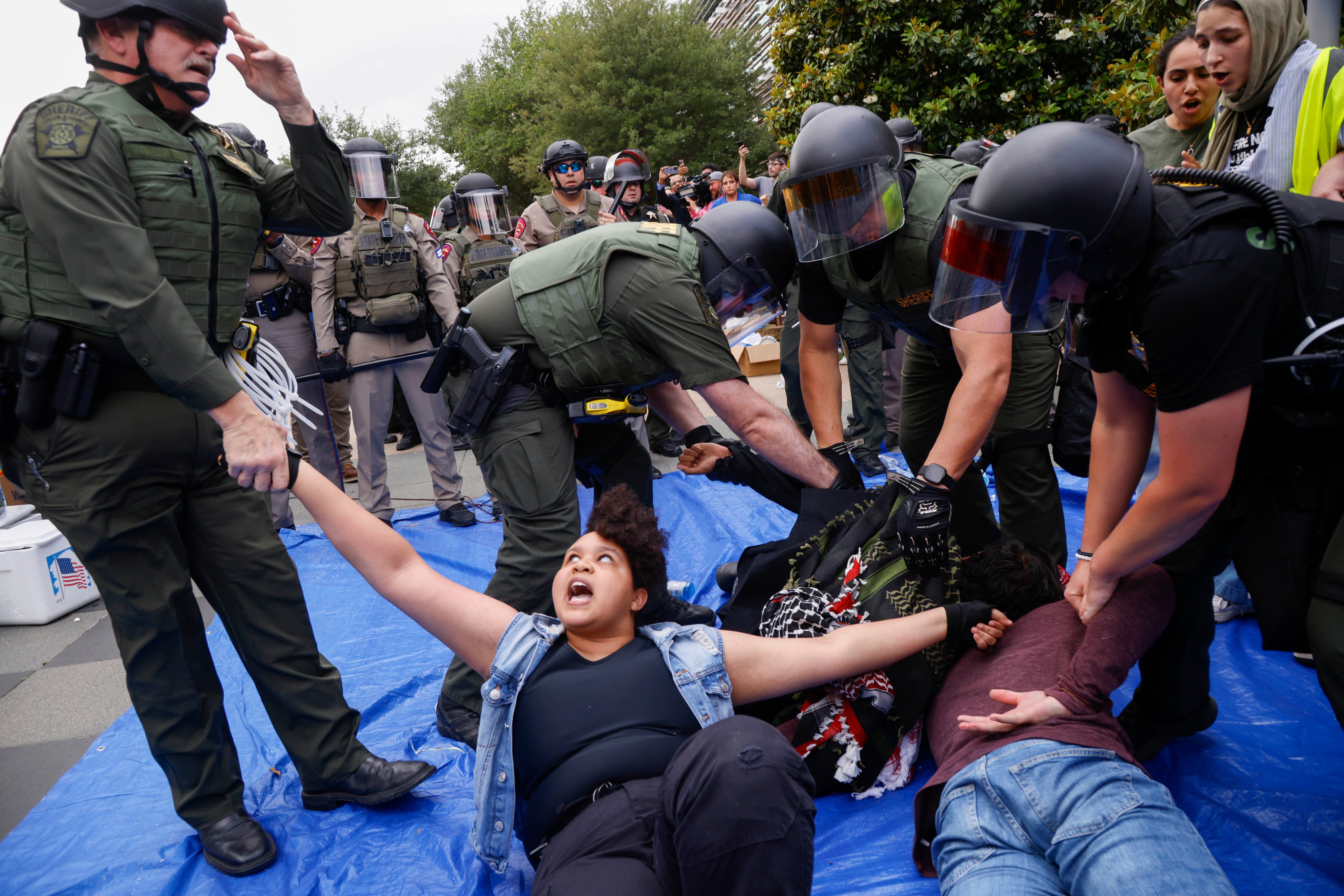Protesters are taken into custody as law enforcement dismantle an encampment by pro-Palestinian students at the University of Texas on May 1, 2024, in Richardson, Texas. Photo: AP