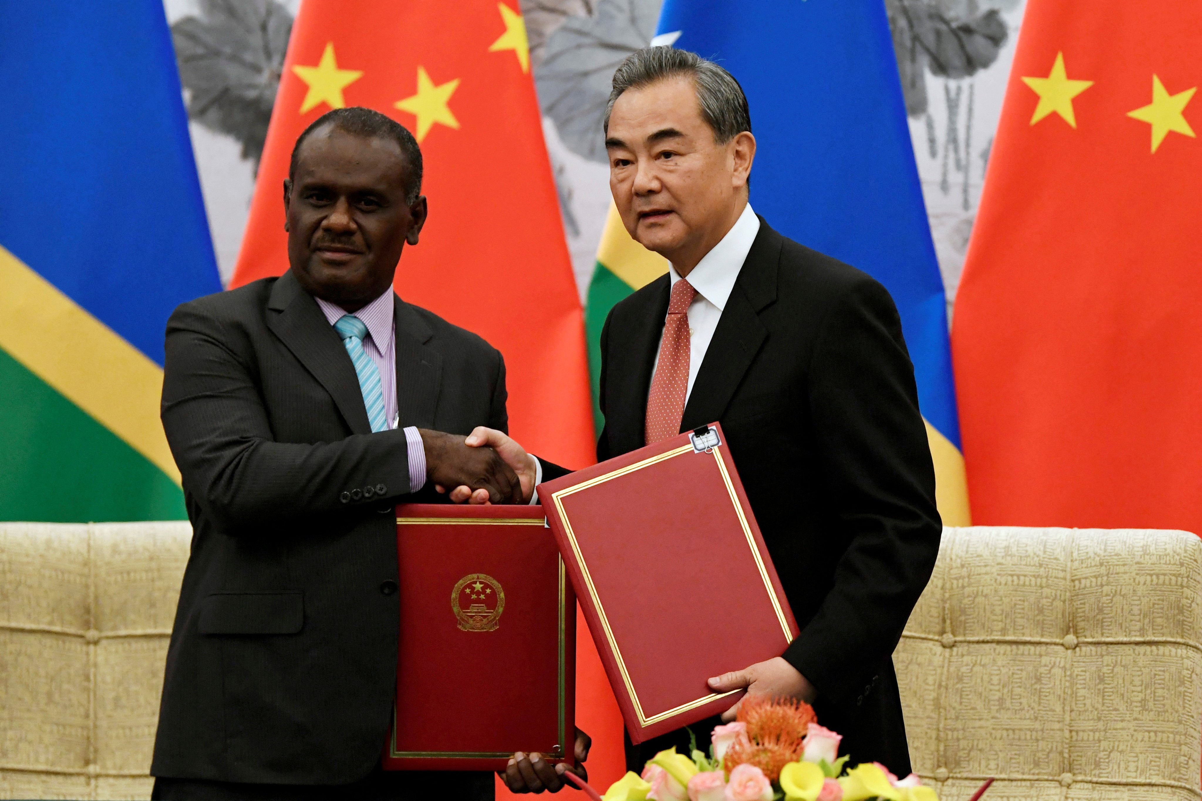 Chinese Foreign Minister Wang Yi shakes hands with Solomon Islands then Foreign Minister Jeremiah Manele at an event in Beijing in 2019. Manele has been chosen as the Solomons’ new prime minister. Photo: Reuters
