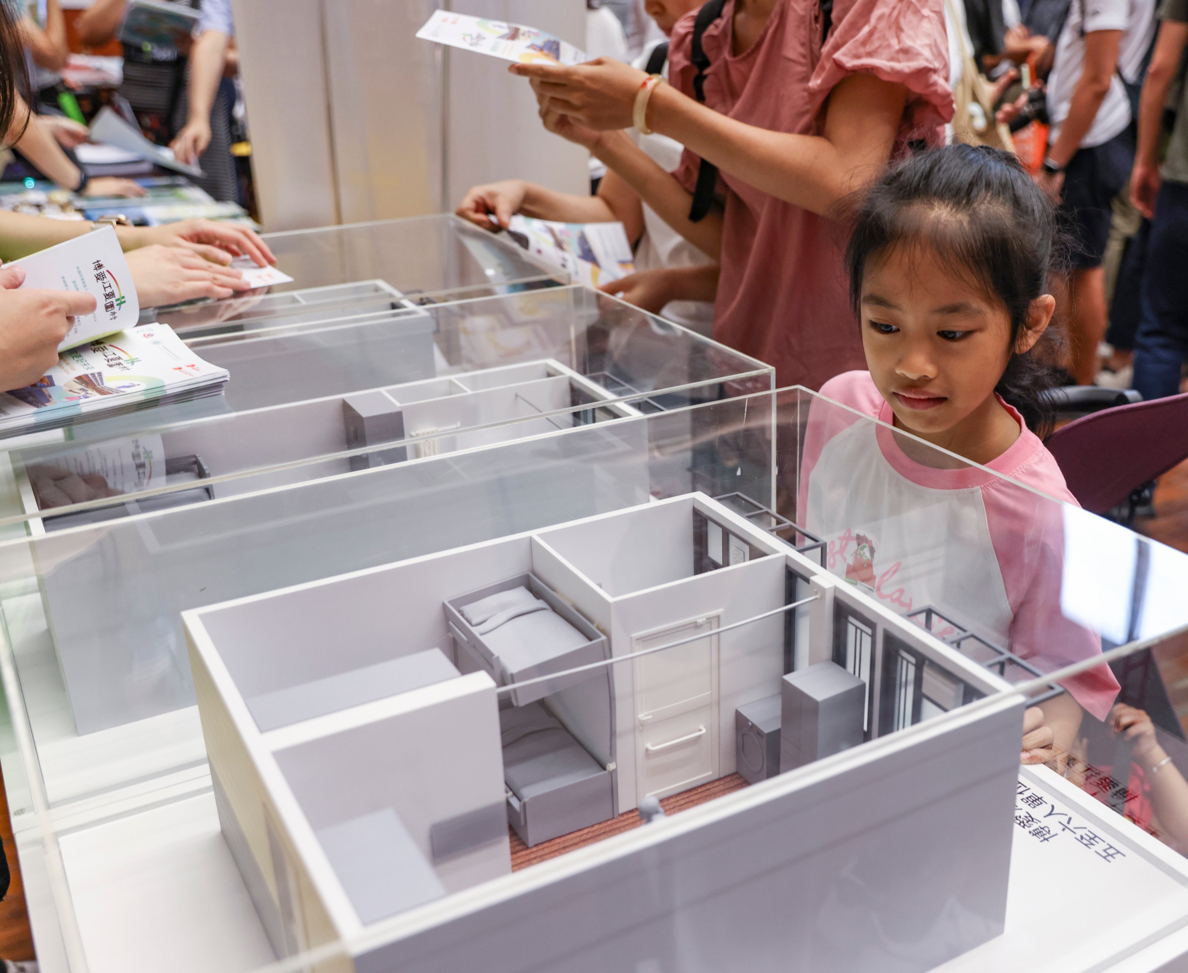 Residents view mock-ups of transitional housing to be offered to those living in subdivided flats. Photo: Yik Yeung-man