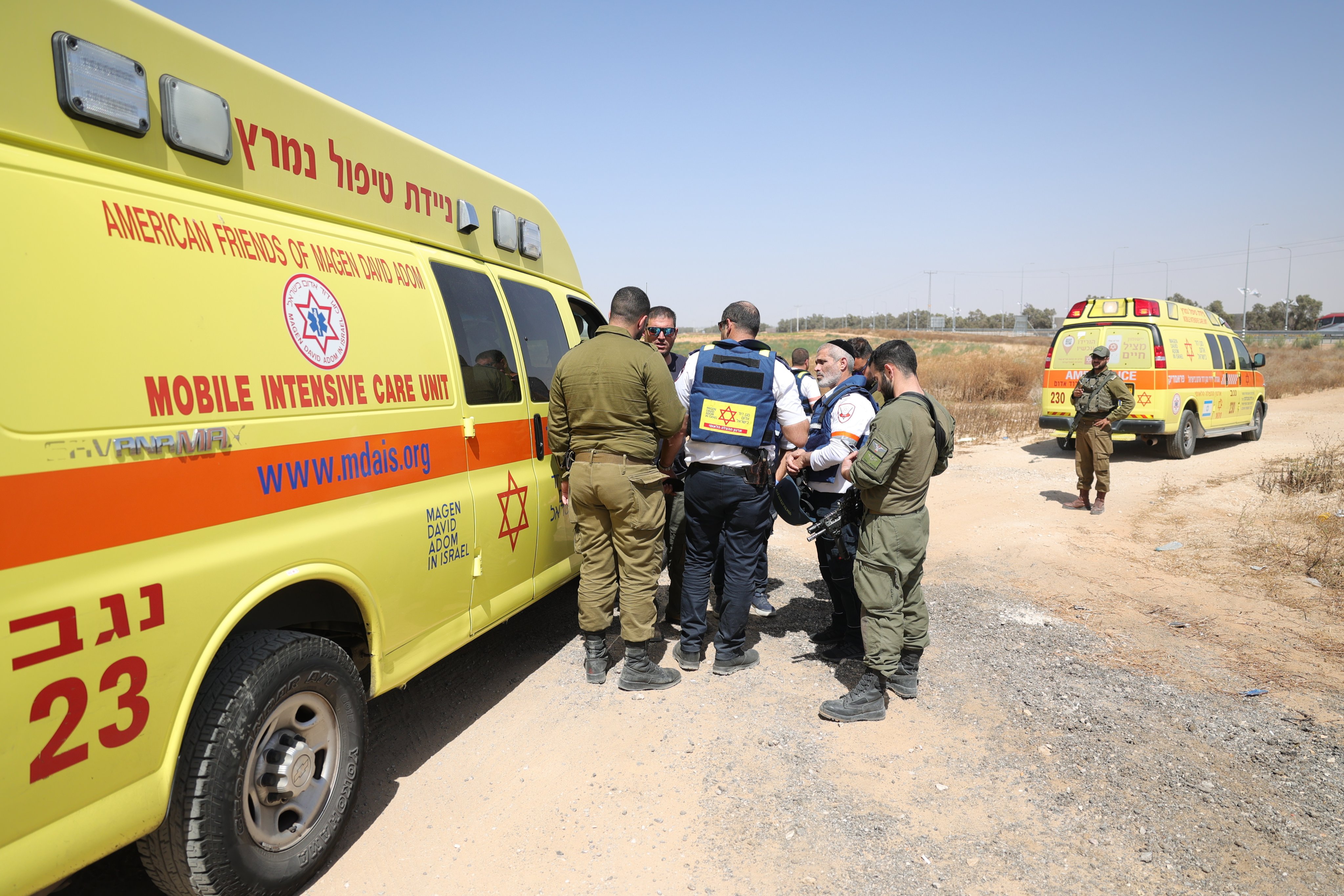 Israeli soldiers and paramedics gather near the Kerem Shalom crossing in southern Israel at the border with the Gaza Strip on Sunday after an attack by Hamas militants. Photo: EPA-EFE