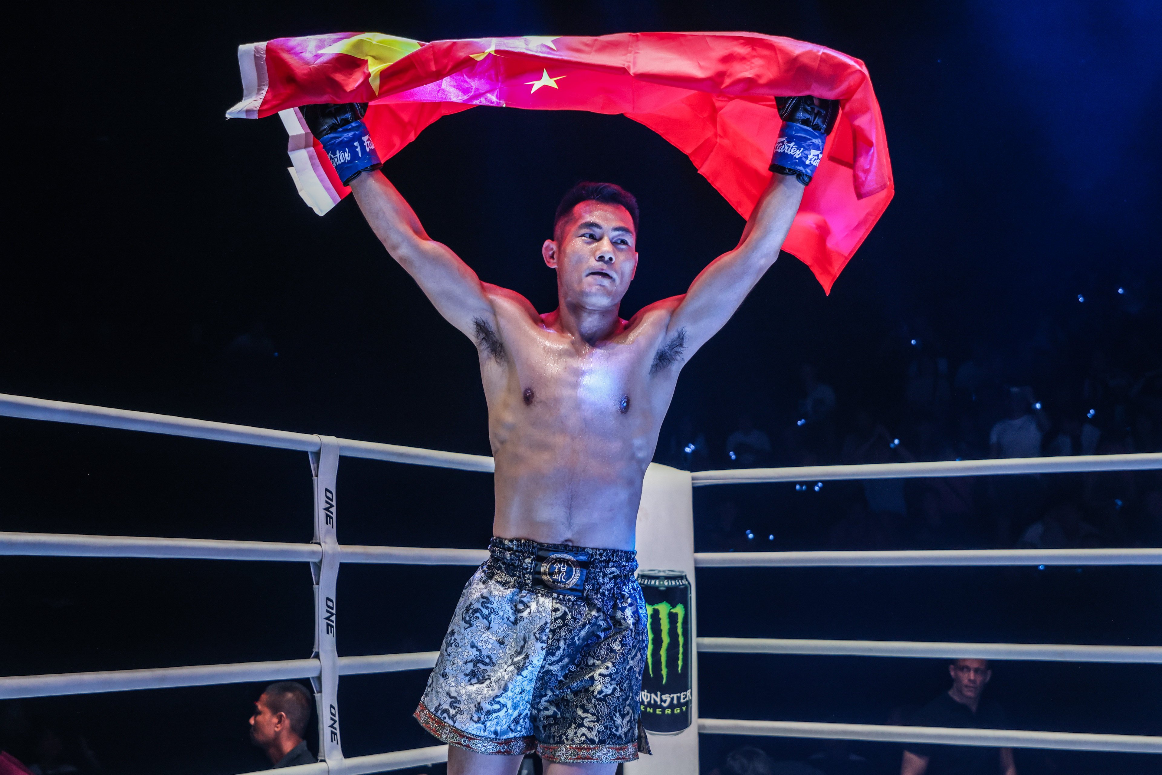 Wei Rui raises the Chinese flag after beating Hiroki Akimoto on his ONE Championship debut at ONE Fight Night 22. Photo: ONE Championship