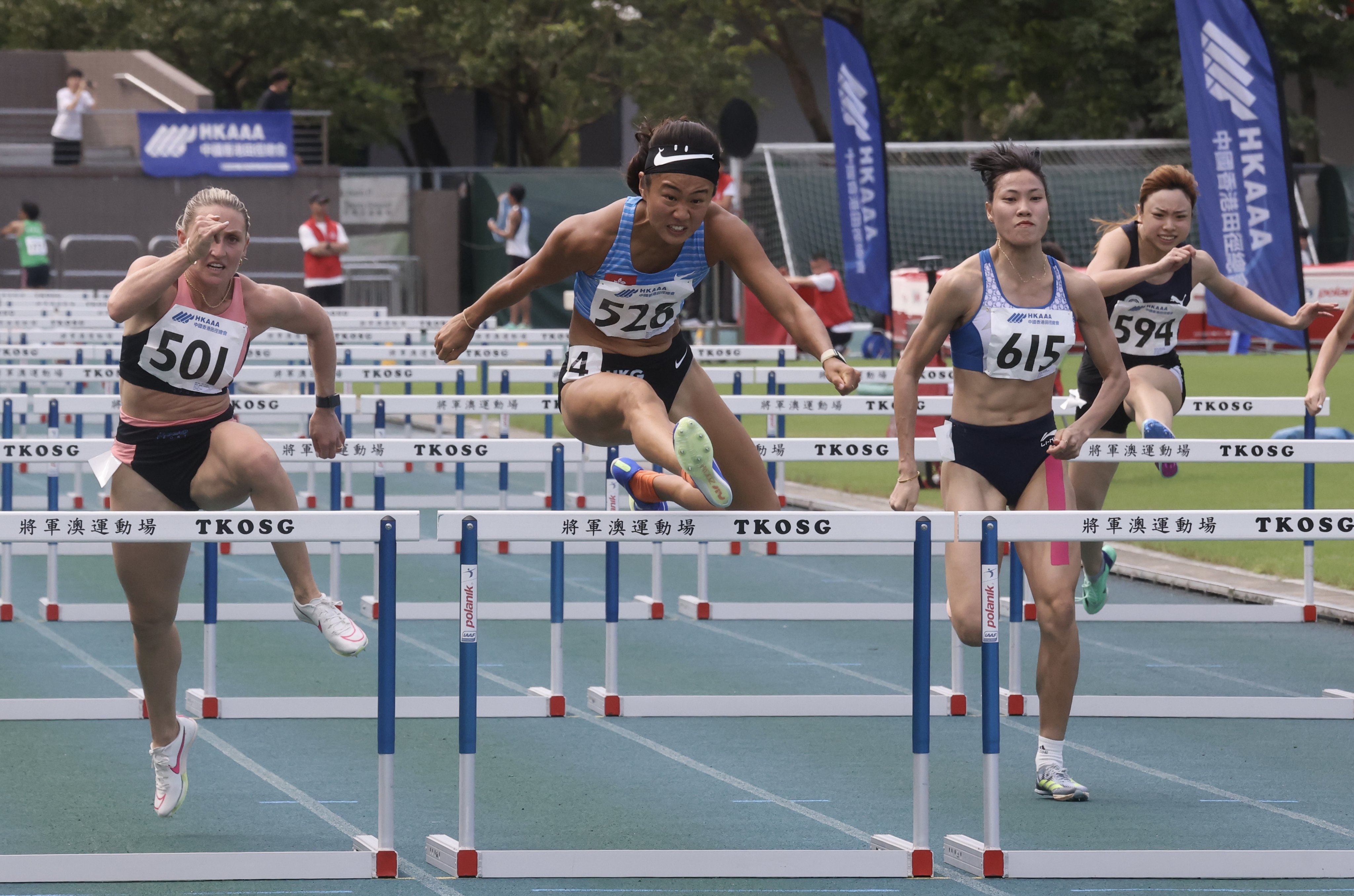 Vera Lui (No 526) is flanked by Abbie Taddeo (left) and Bui Thi Nguyen in the 100m hurdles final in Tseung Kwan O. Photo: Jonathan Wong