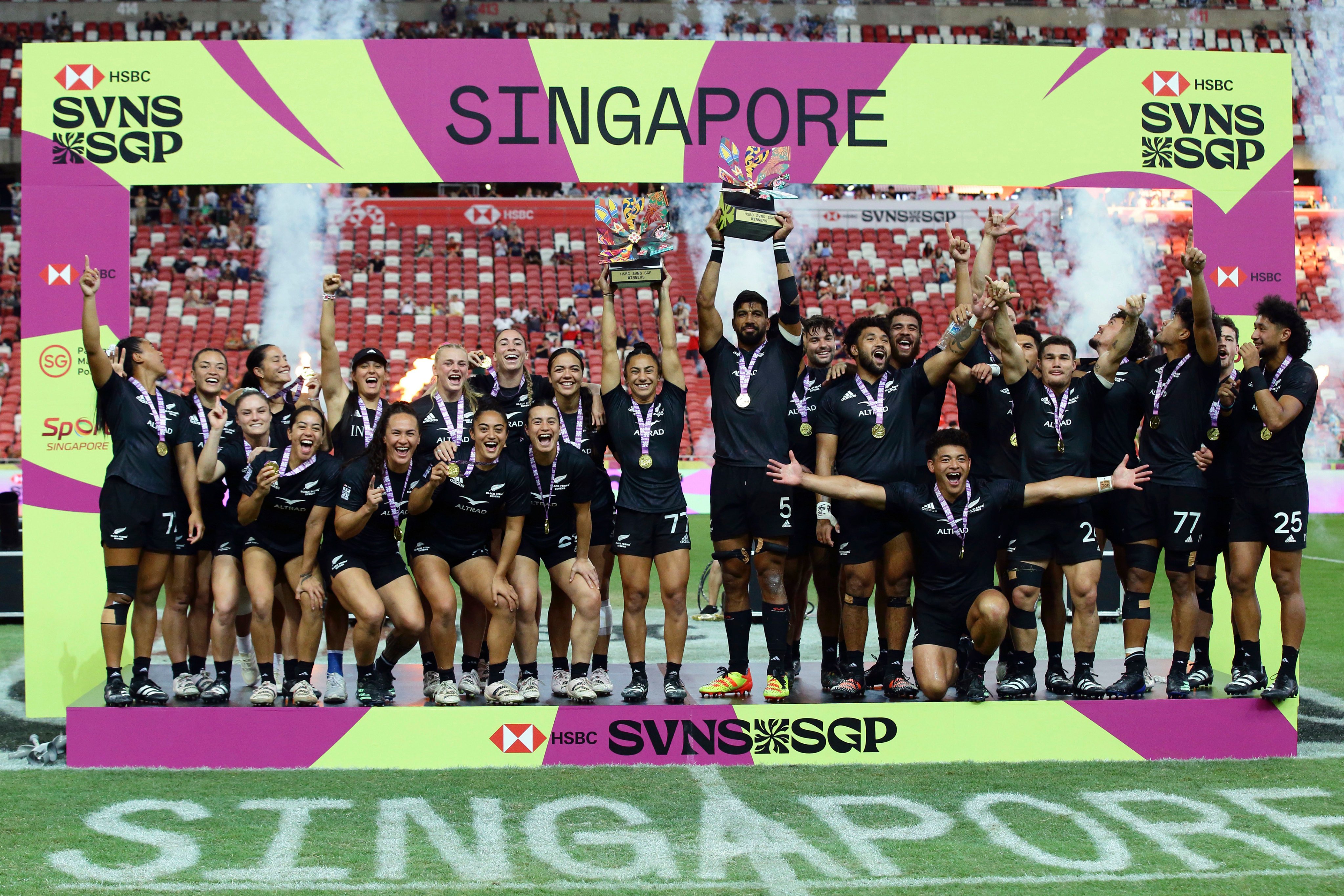 The victorious New Zealand teams celebrate more success in Singapore. Photo: AP