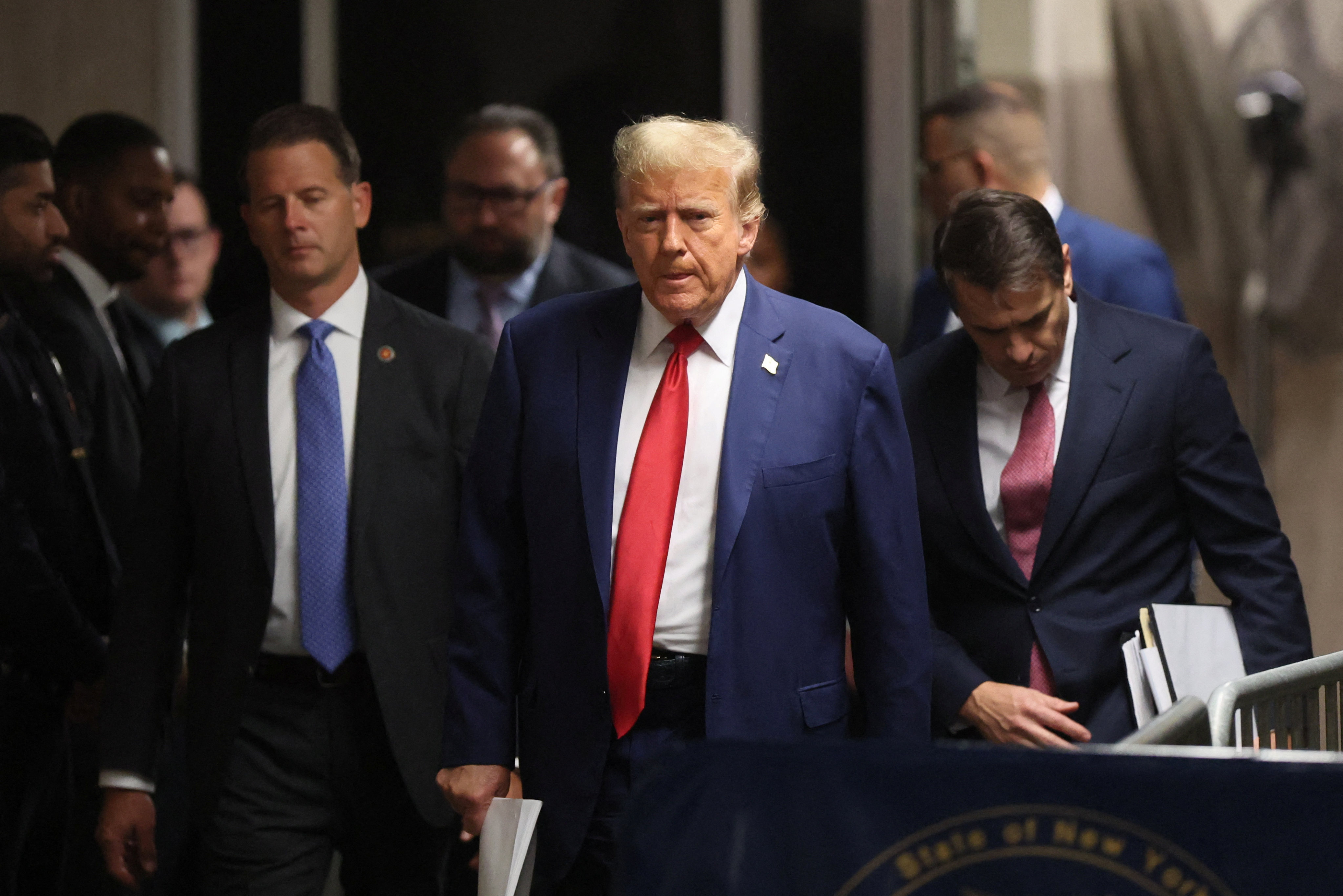 Republican presidential candidate and former US President Donald Trump walks as his criminal trial over charges that he falsified business records to conceal money paid to a porn star continues, at Manhattan state court in New York City, on Monday. Photo: Reuters