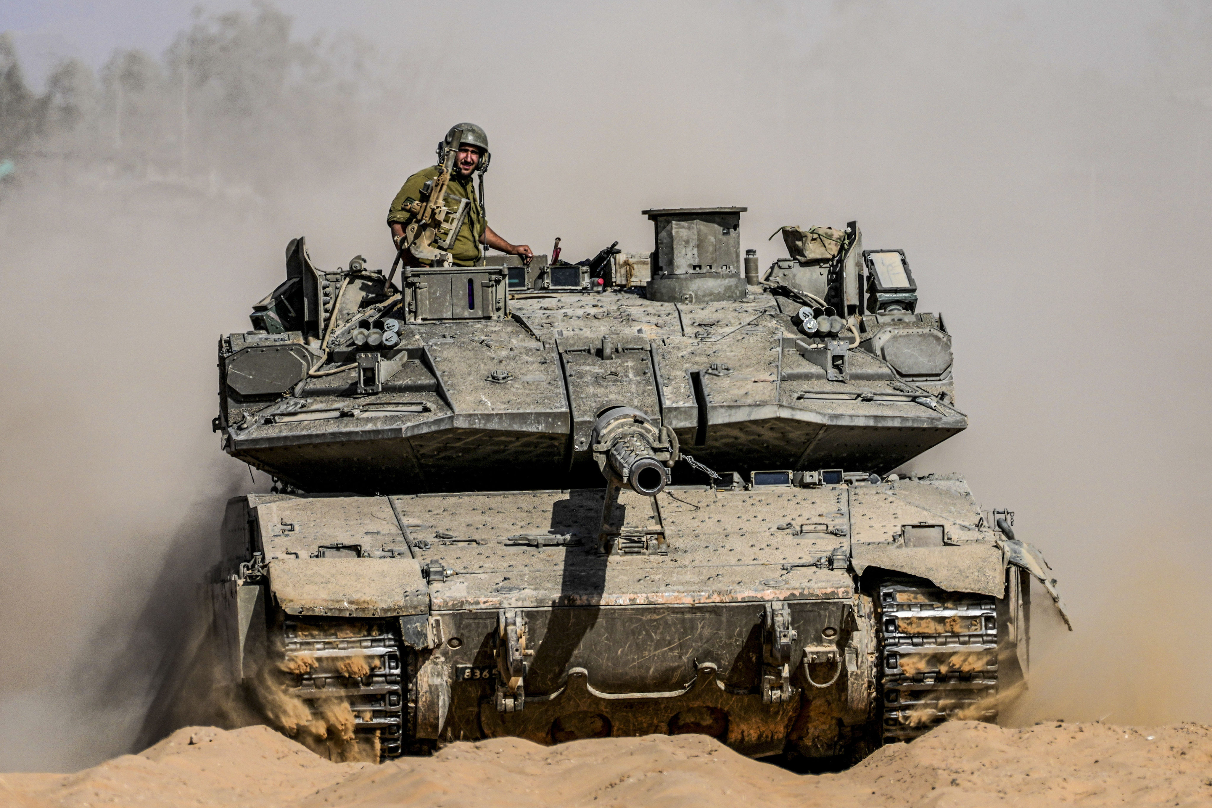 An Israeli tank at a staging ground near the border with the Gaza Strip, in southern Israel, on Sunday. Photo: AP