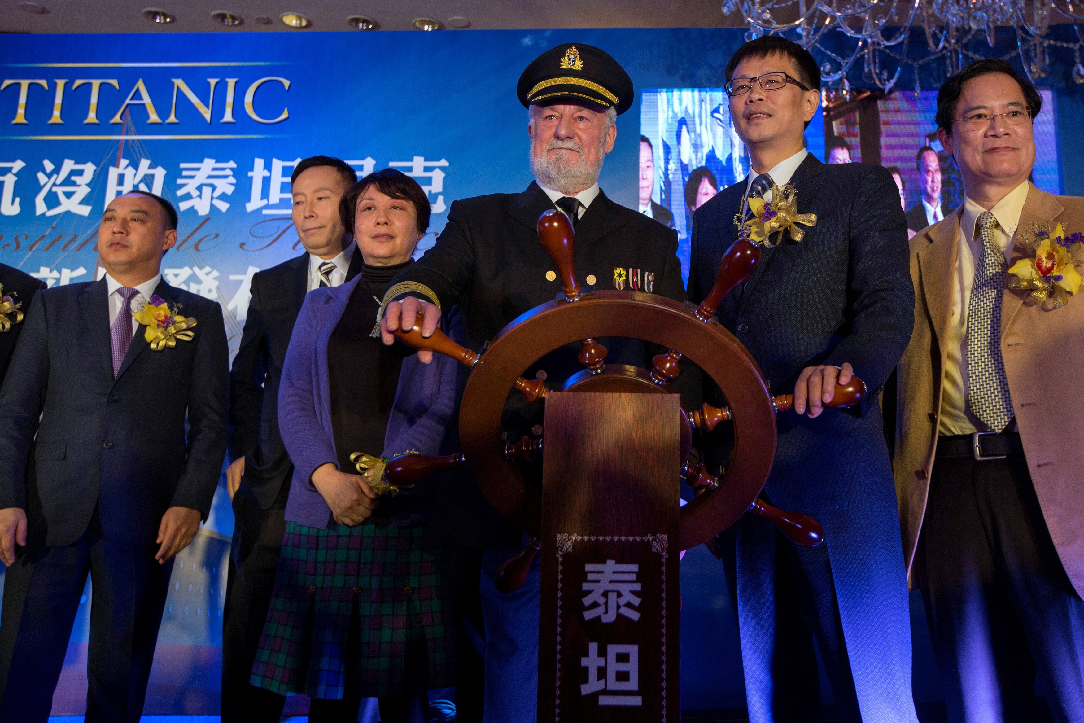 Actor Bernard Hill, third from right, who played Captain Edward Smith in the 1997 film Titanic, poses with Su Shaojun, second right, CEO of Seven-Star Energy Investment Group, in Hong Kong in 2014. Hill died on Sunday at the age of 79. Photo: Reuters 