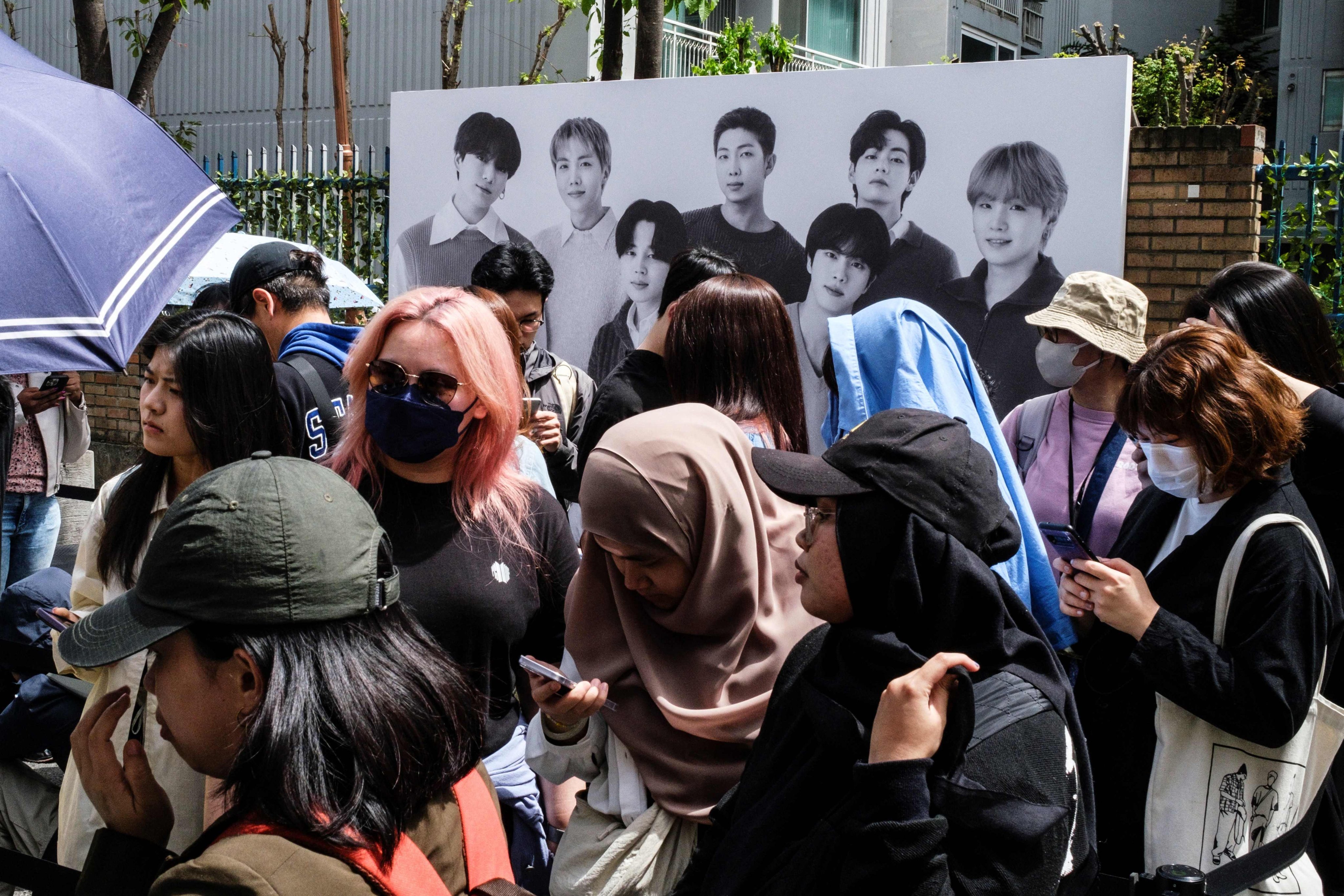 Fans wait outside BTS’ Seoul pop-up store, Monochrome, on its opening day. The pop-up has attracted members of the band’s Army fandom in their droves. Photo: AFP