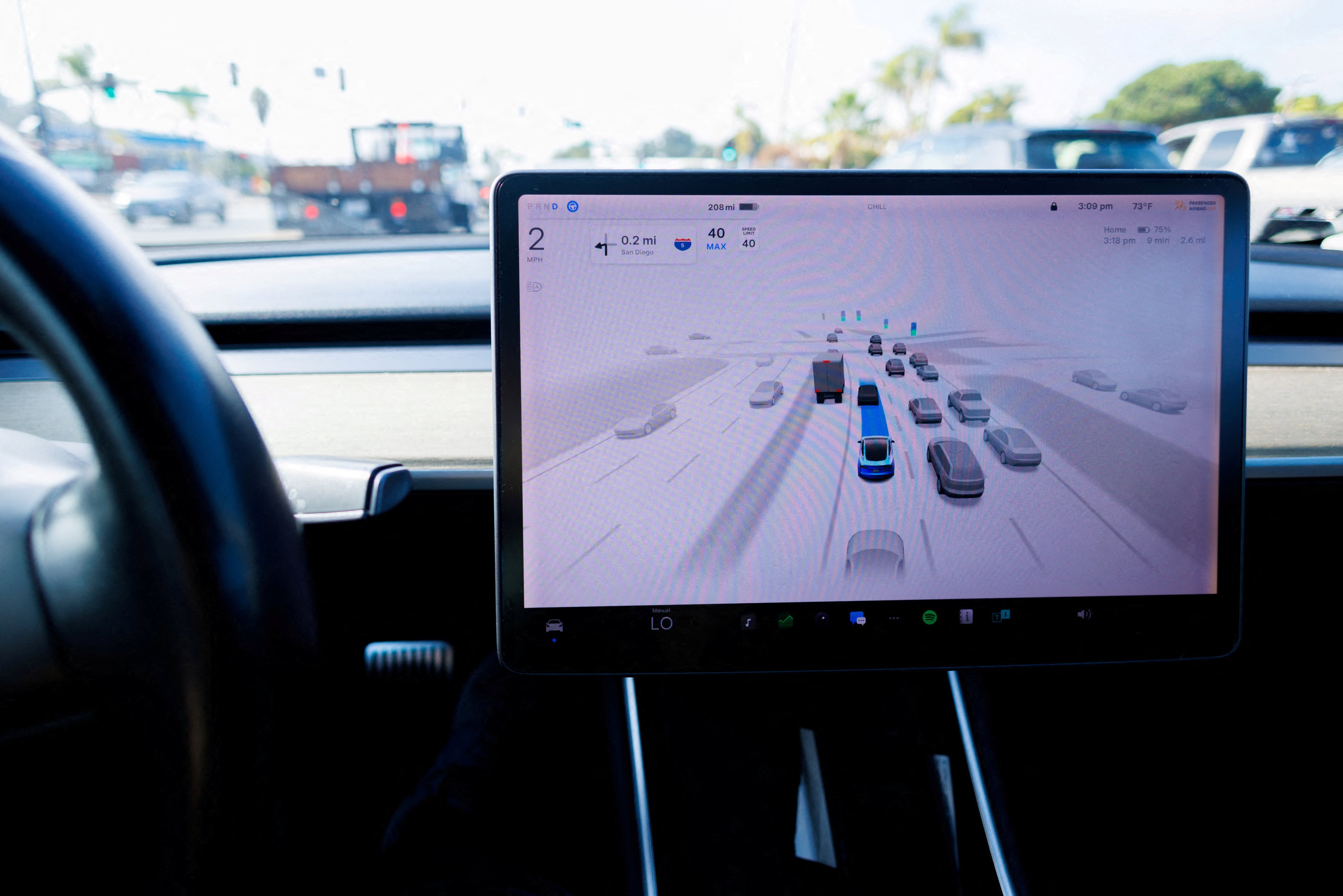 A Tesla Model 3 vehicle in full-self driving mode in Encinitas, California, October 18, 2023. Photo: Reuters