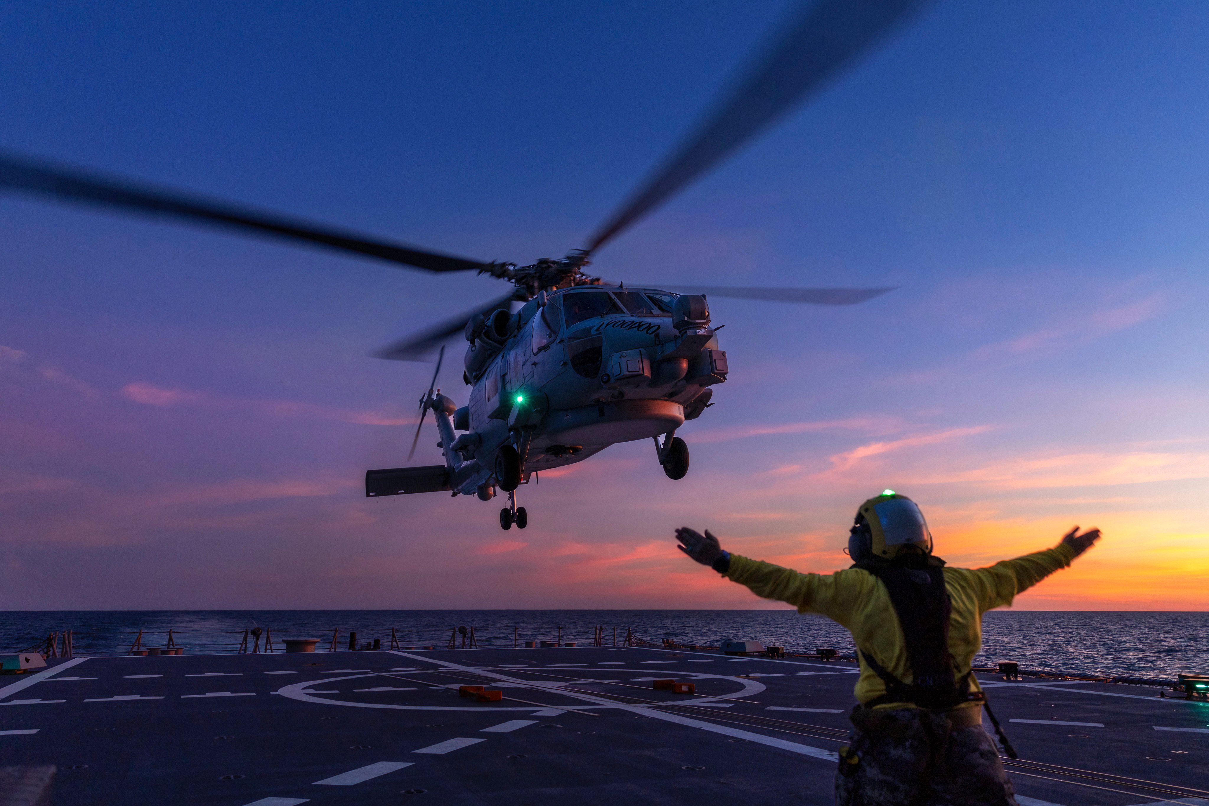 In this undated photo from the Australian Defence Force, a Seahawk helicopter prepares to land on the deck of HMAS Hobart during flying operations while on a regional presence deployment off northern Australia. Photo: Australian Defence Force/AP