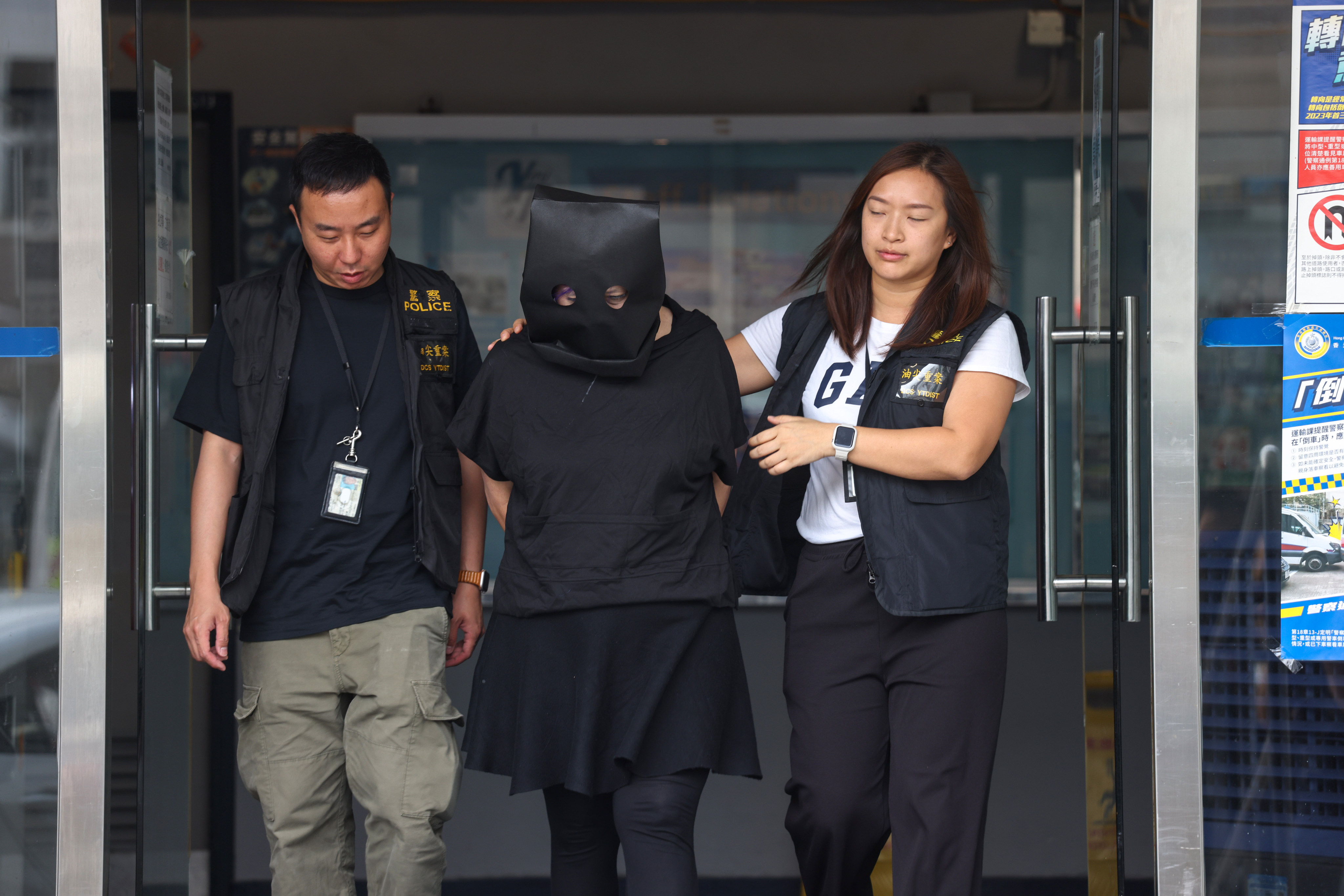 One of three suspects arrested over the kidnapping is taken to Tsim Sha Tsui Police Station. Photo: Yik Yeung-man