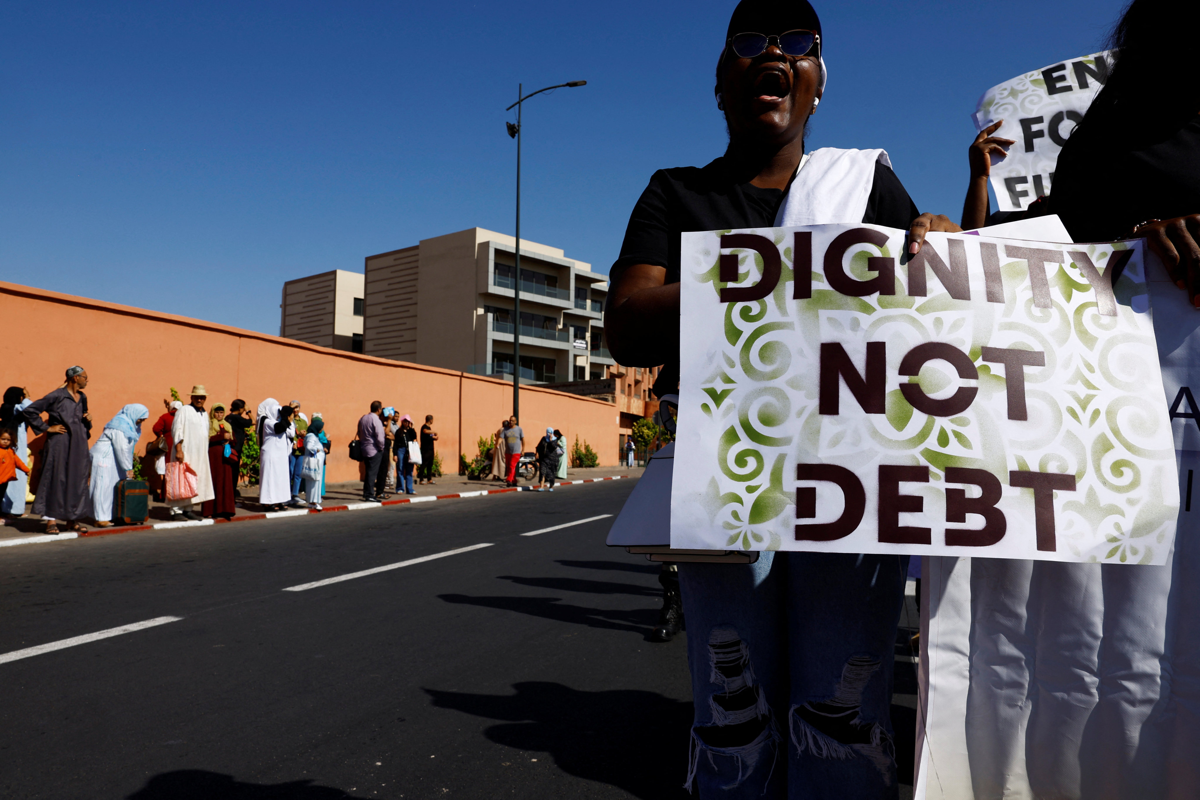 Activists march to demand climate and debt justice during the annual meetings of the International Monetary Fund and World Bank Group in Marrakech, Morocco, on October 12, 2023. Photo: Reuters