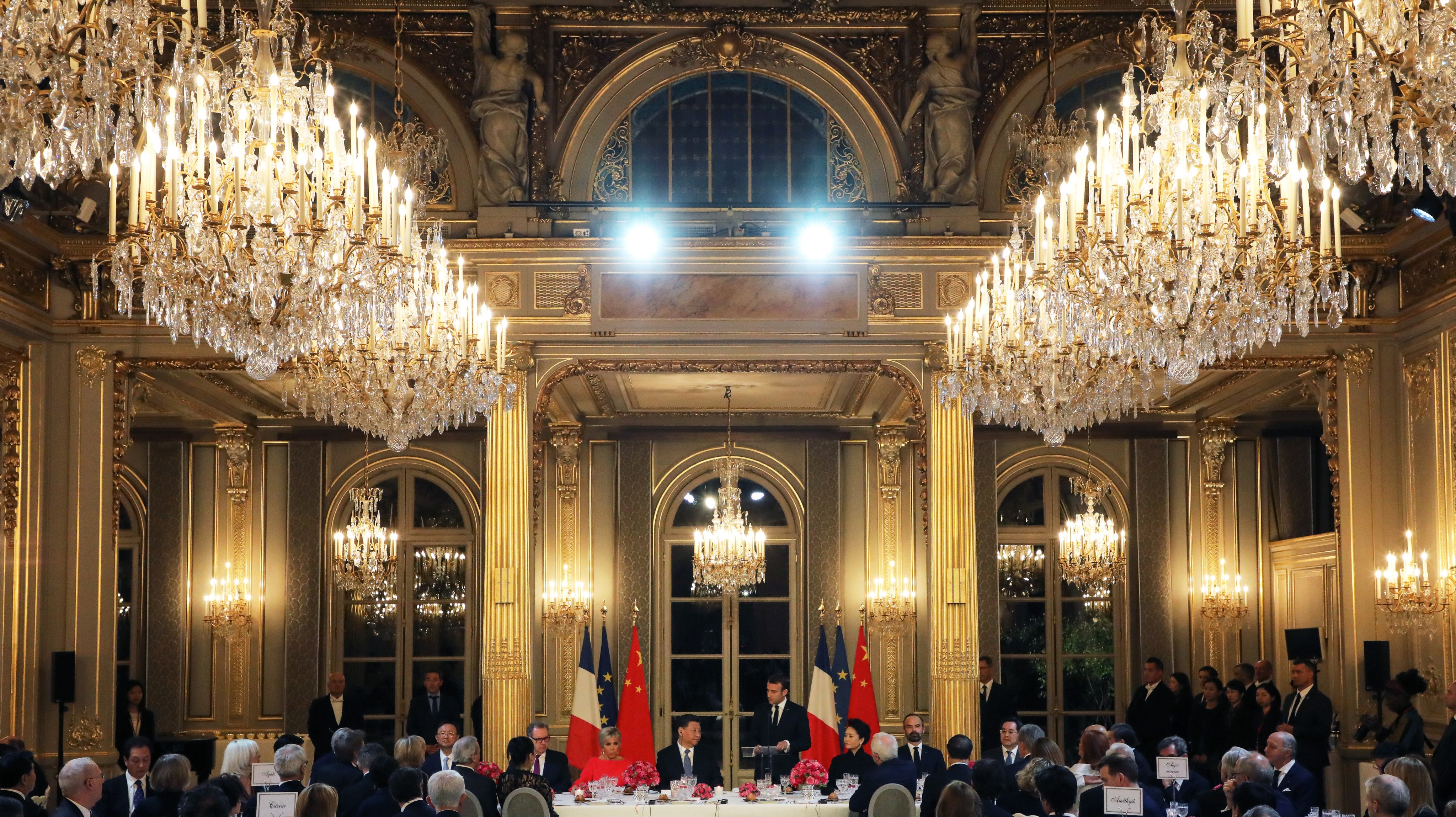 French President Emmanuel Macron (centre, right) speaks at a 2019 state dinner for Chinese President Xi Jinping at the Elysee Palace, which more than 200 guests attended.  Photo: EPA-EFE