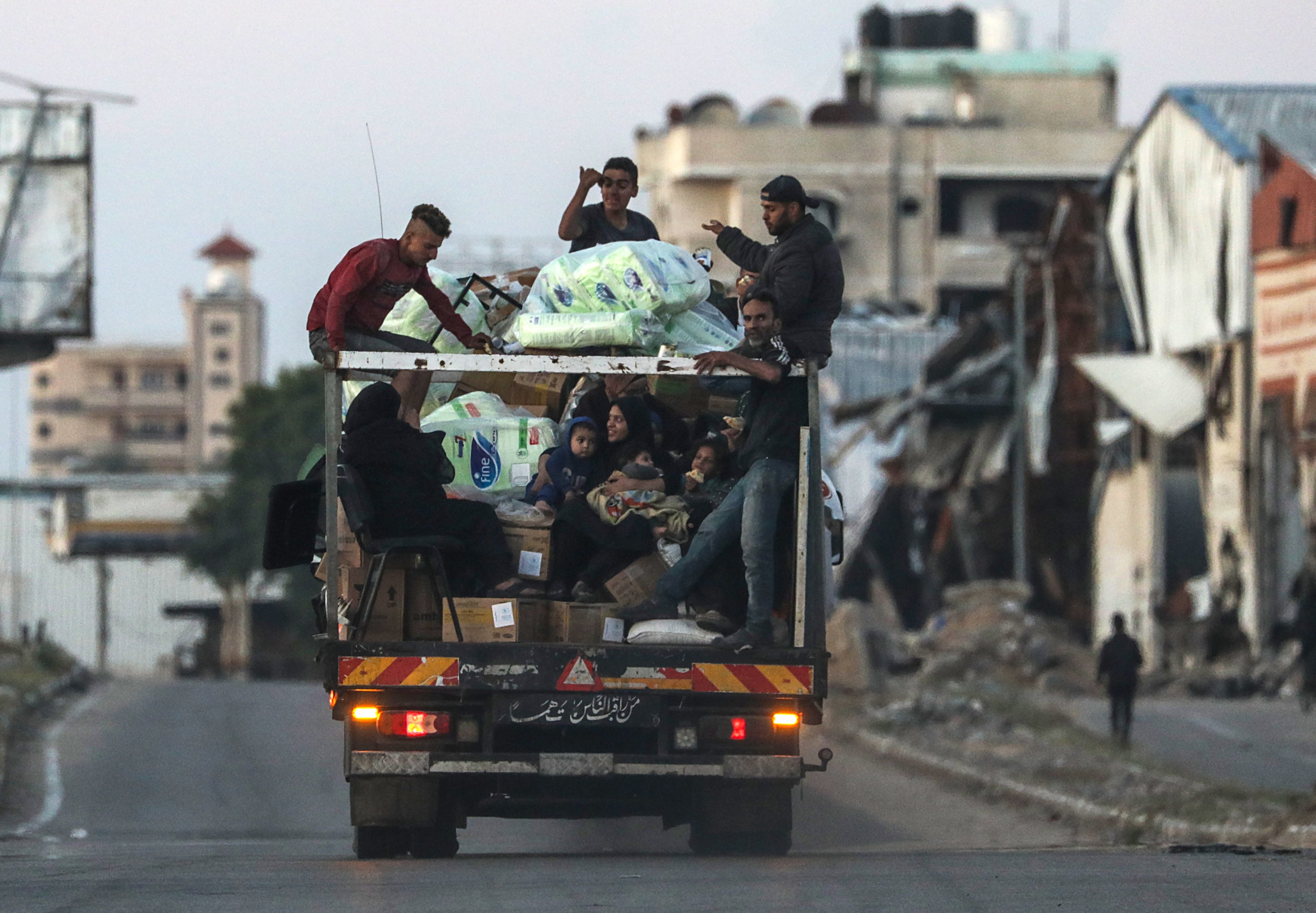 Palestinians leave with their belongings following an evacuation order issued by the Israeli army in the southern Gaza city of Rafah on Monday. Photo: EPA-EFE