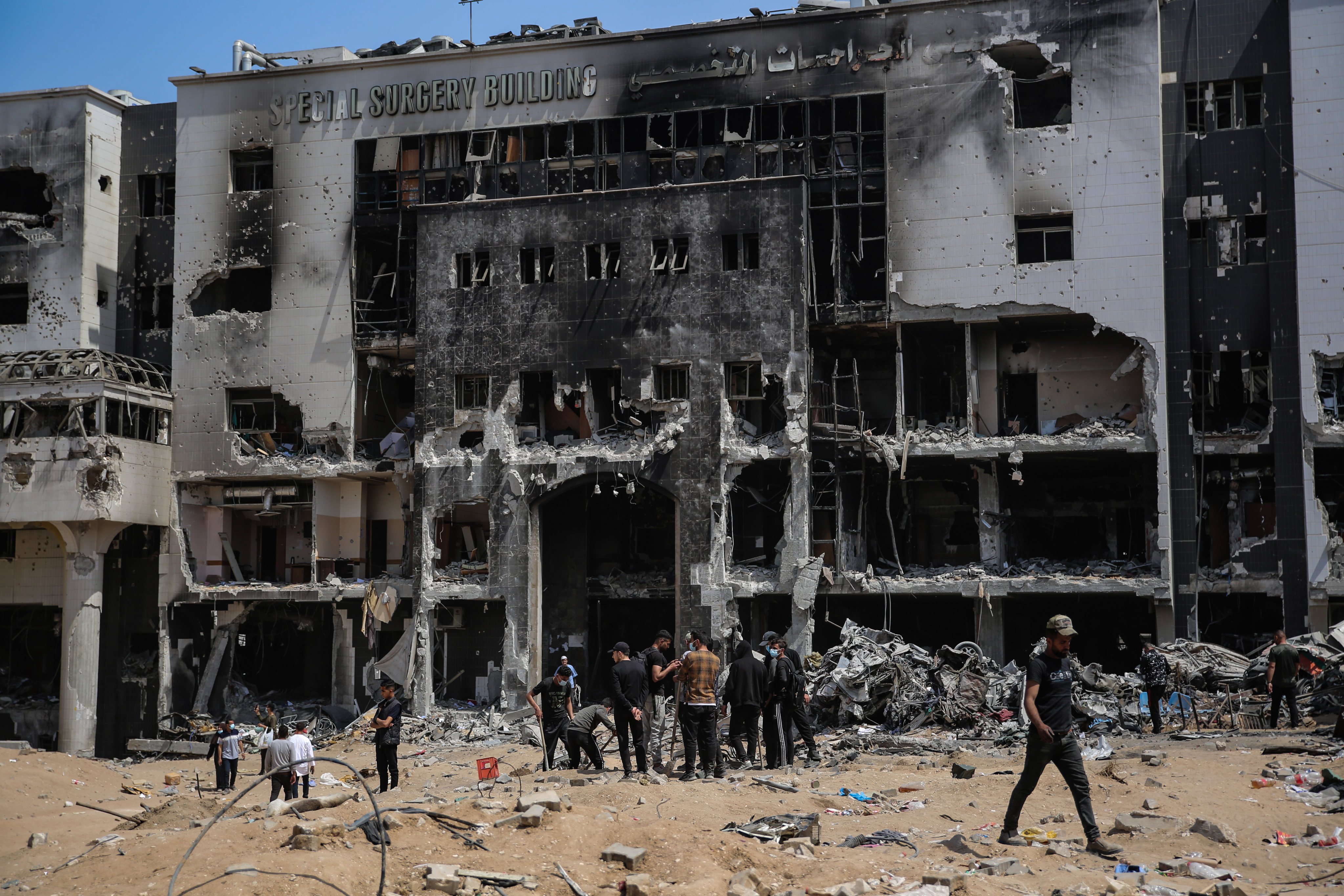 Palestinians inspect the damage at al-Shifa Hospital complex on April 2. Gaza officials say 49 more bodies have been found at the hospital. Photo: dpa