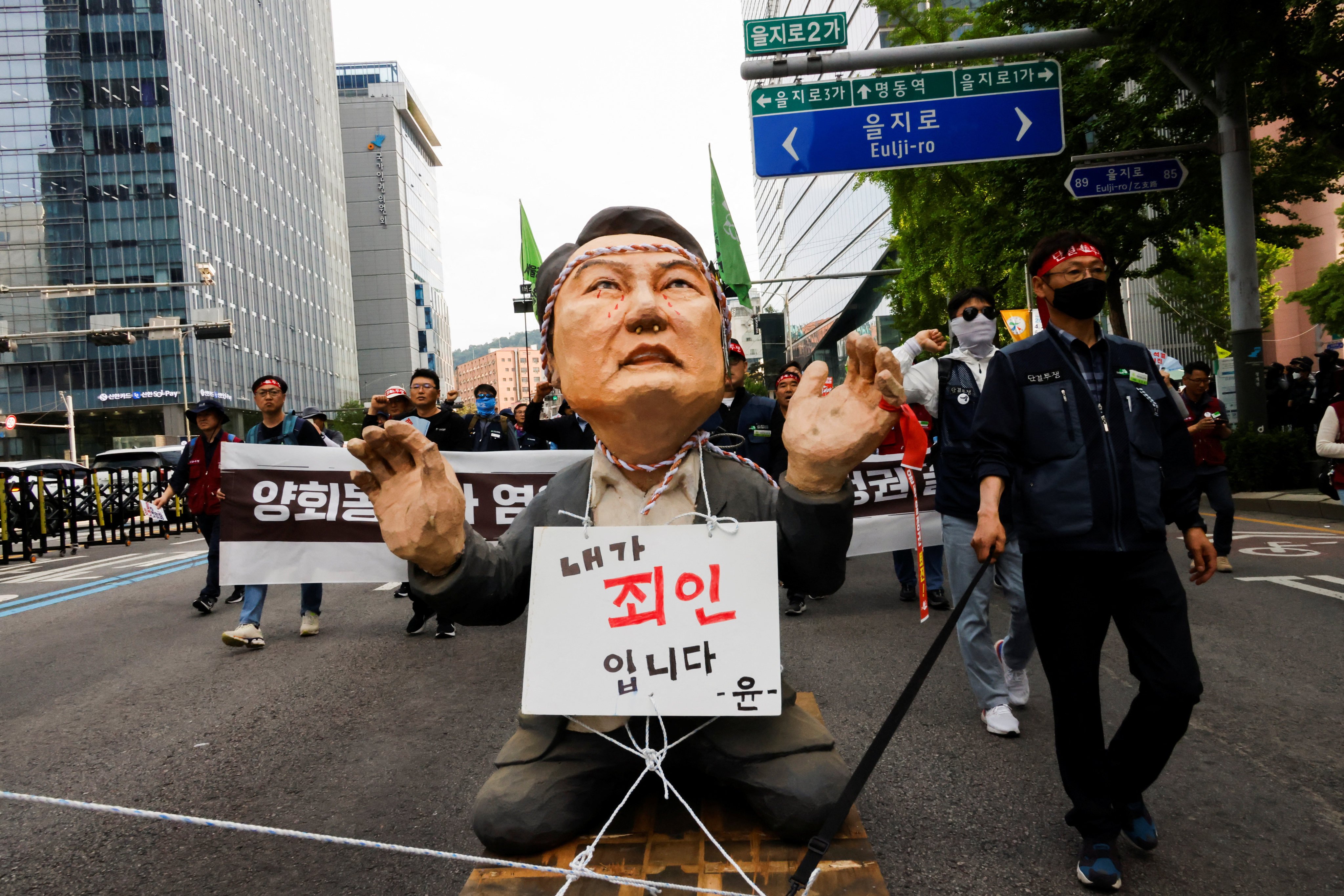 Trade unionists rally in Seoul on May 1 with an effigy of South Korean President Yoon Seok-yeol carrying a sign that reads “I am a sinner”. Yoon has largely shied away from the media spotlight. Photo: Reuters