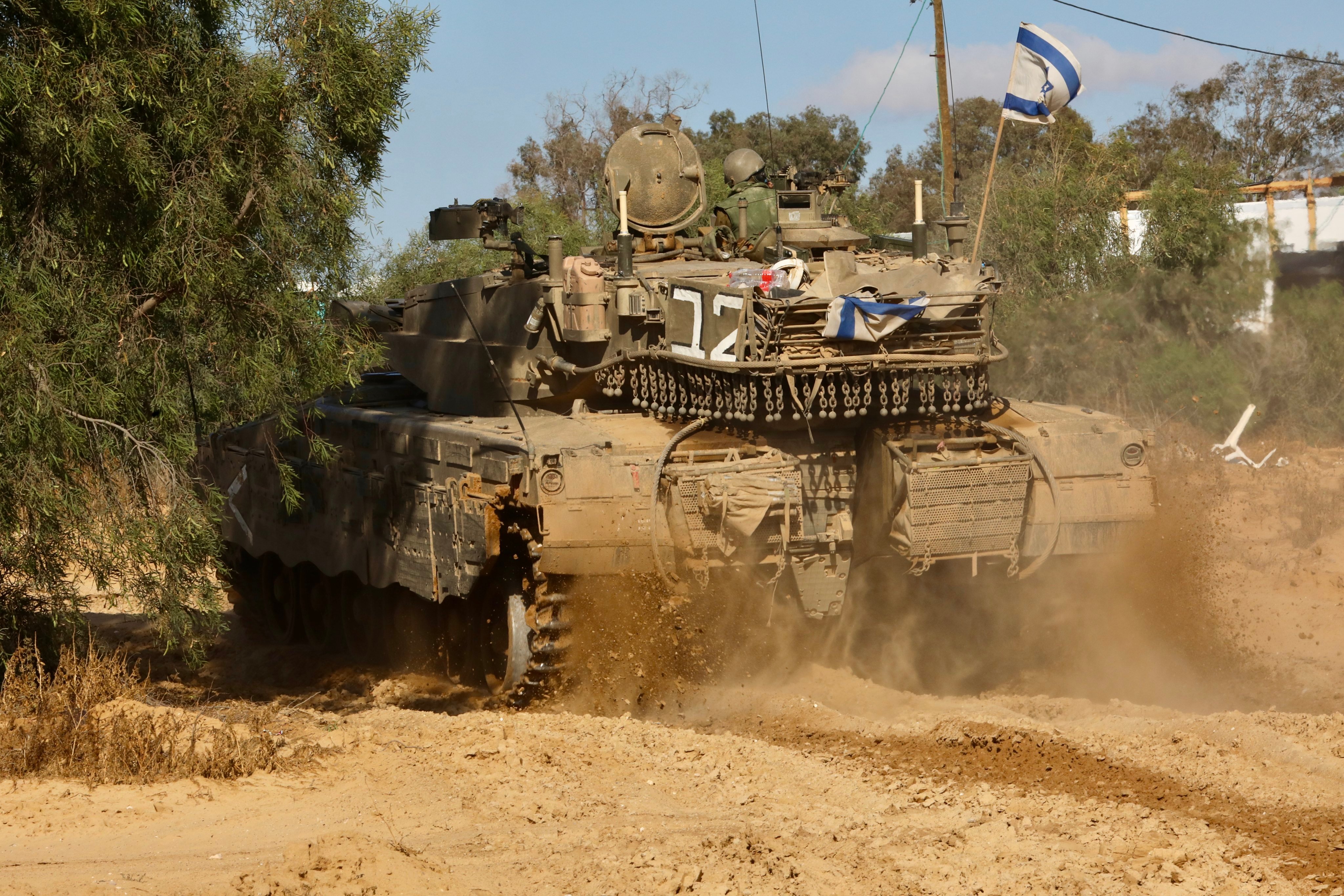 An Israeli tank is seen near the Shalom Kerem crossing in southern Israel, bordering the Gaza Strip. Photo: Xinhua