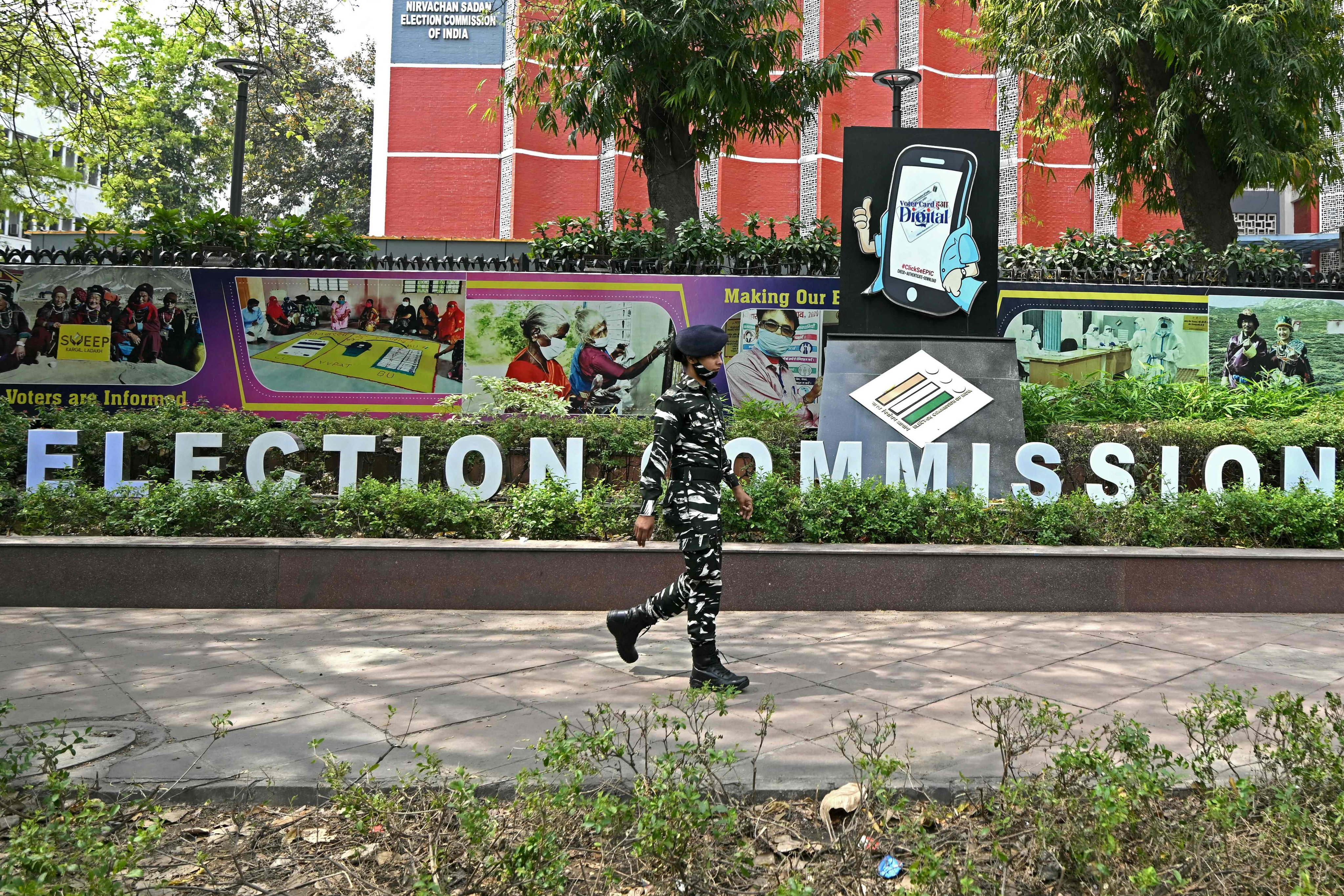 A security personnel walks past the office of the election commission of India. The commission is facing accusations from political parties and civil groups for showing bias towards the ruling Bharatiya Janata Party. Photo: AFP