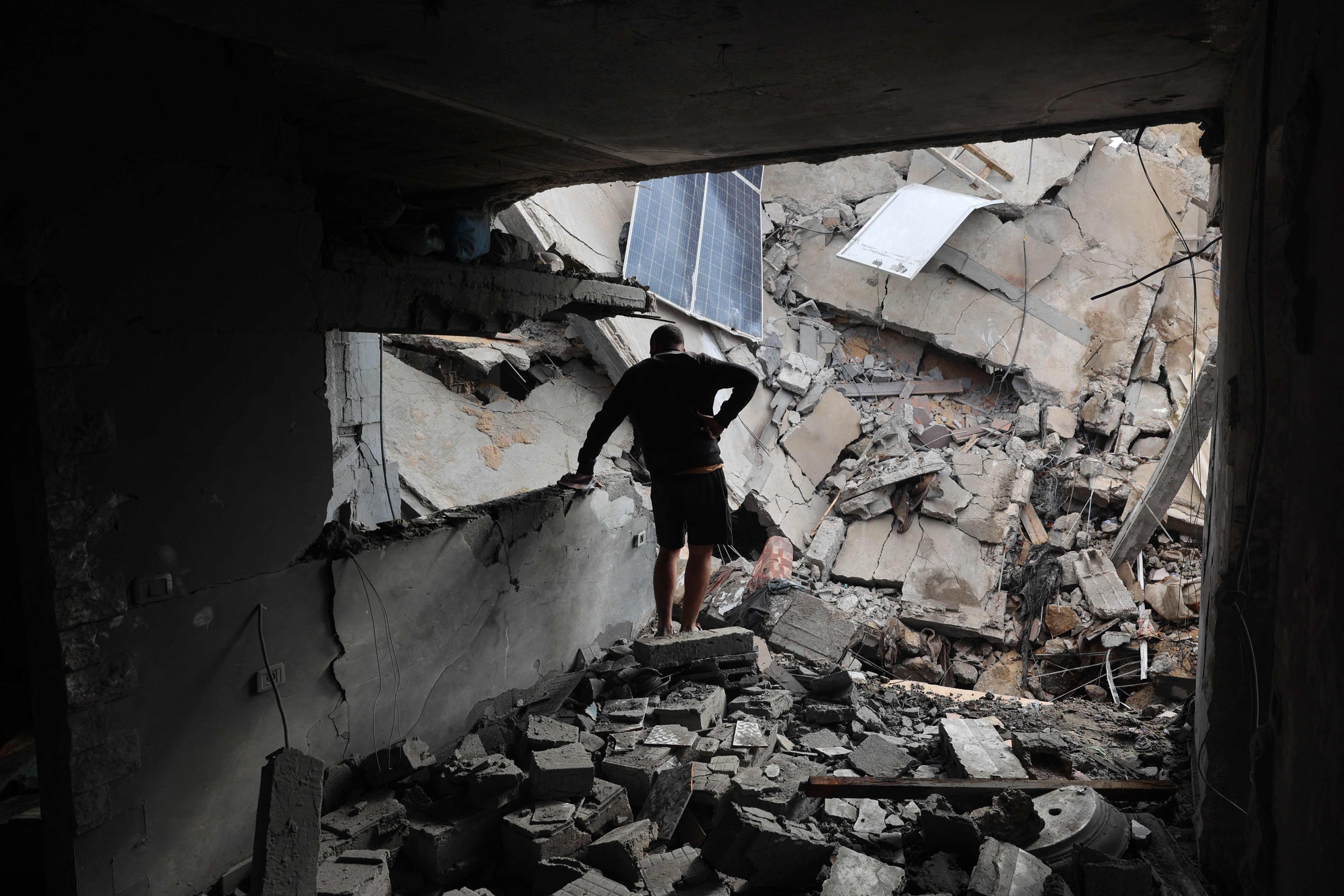 A Palestinian man inspects the destruction outside a house struck by Israeli bombardment in Rafah’s Tal al-Sultan district in the southern Gaza Strip. Photo: AFP