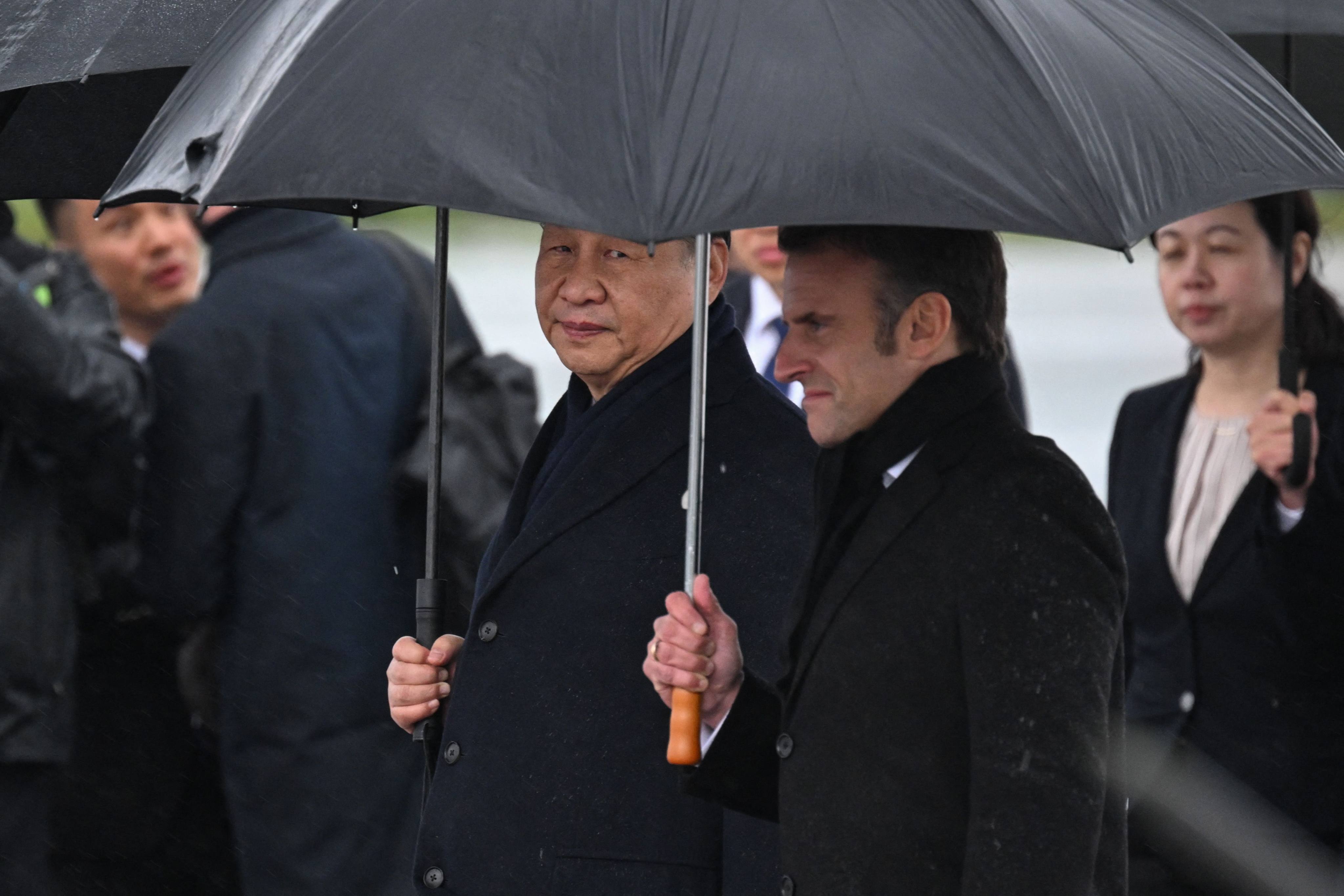 Chinese President Xi Jinping and French President Emmanuel Macron at Tarbes airport in southwestern France on Tuesday. Photo: AFP