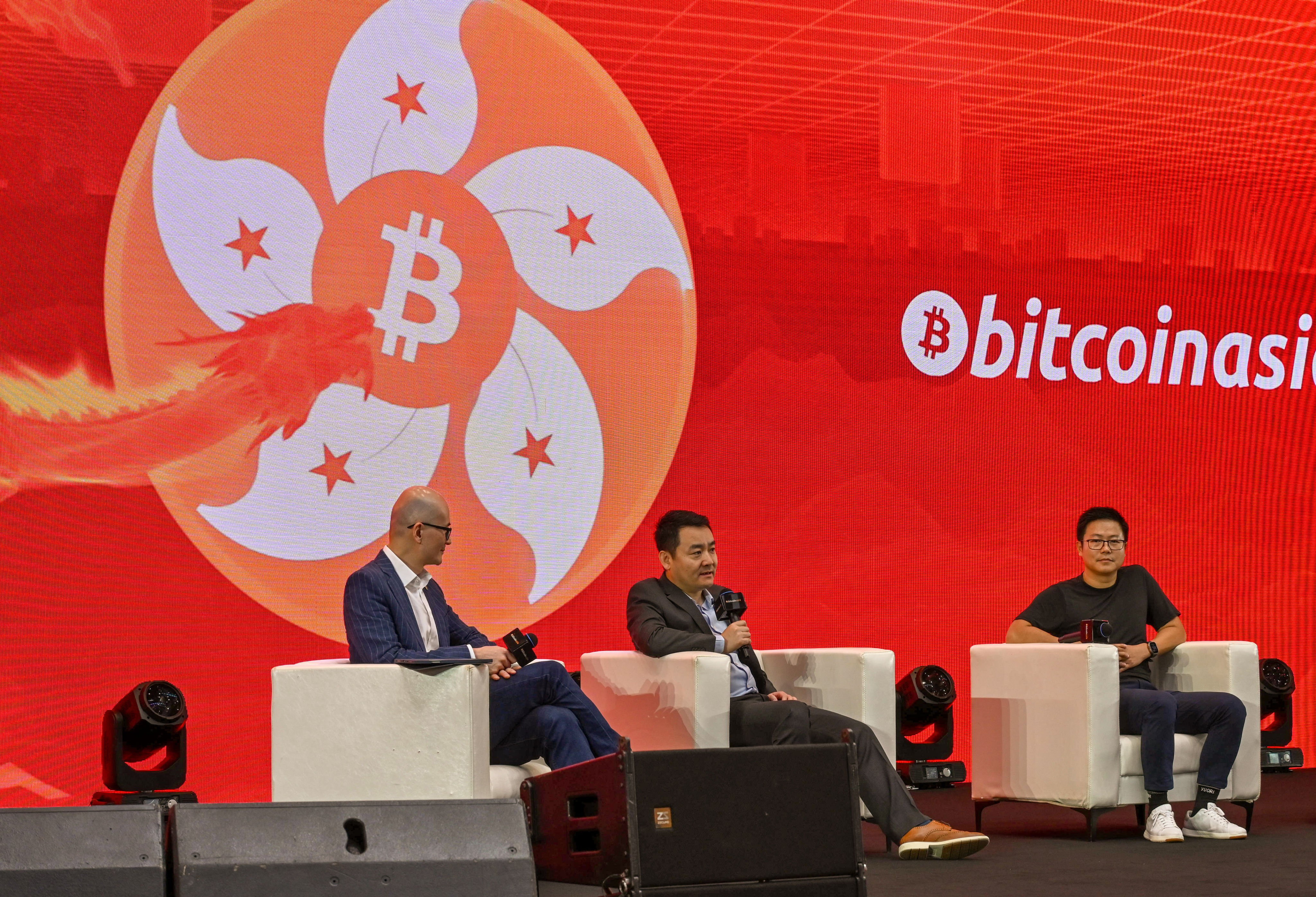Harvest Global Investments CEO Han Tongli (centre) speaks during a panel discussion on Hong Kong’s spot bitcoin and ether exchange-traded funds at Bitcoin Asia on May 9, 2024. Photo: SCMP/Matt Haldane