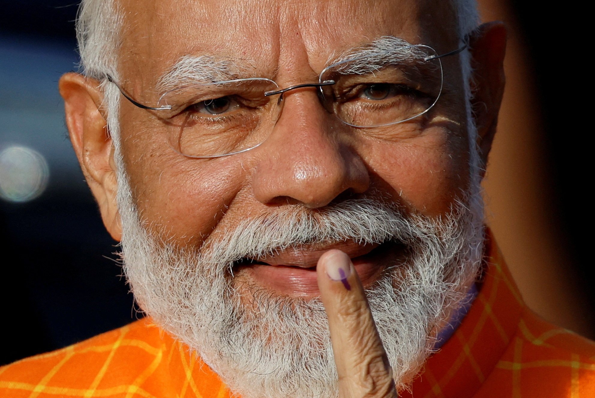 India’s Prime Minister Narendra Modi shows his ink-marked finger after voting at a polling station in Ahmedabad, India on Tuesday. Photo: Reuters