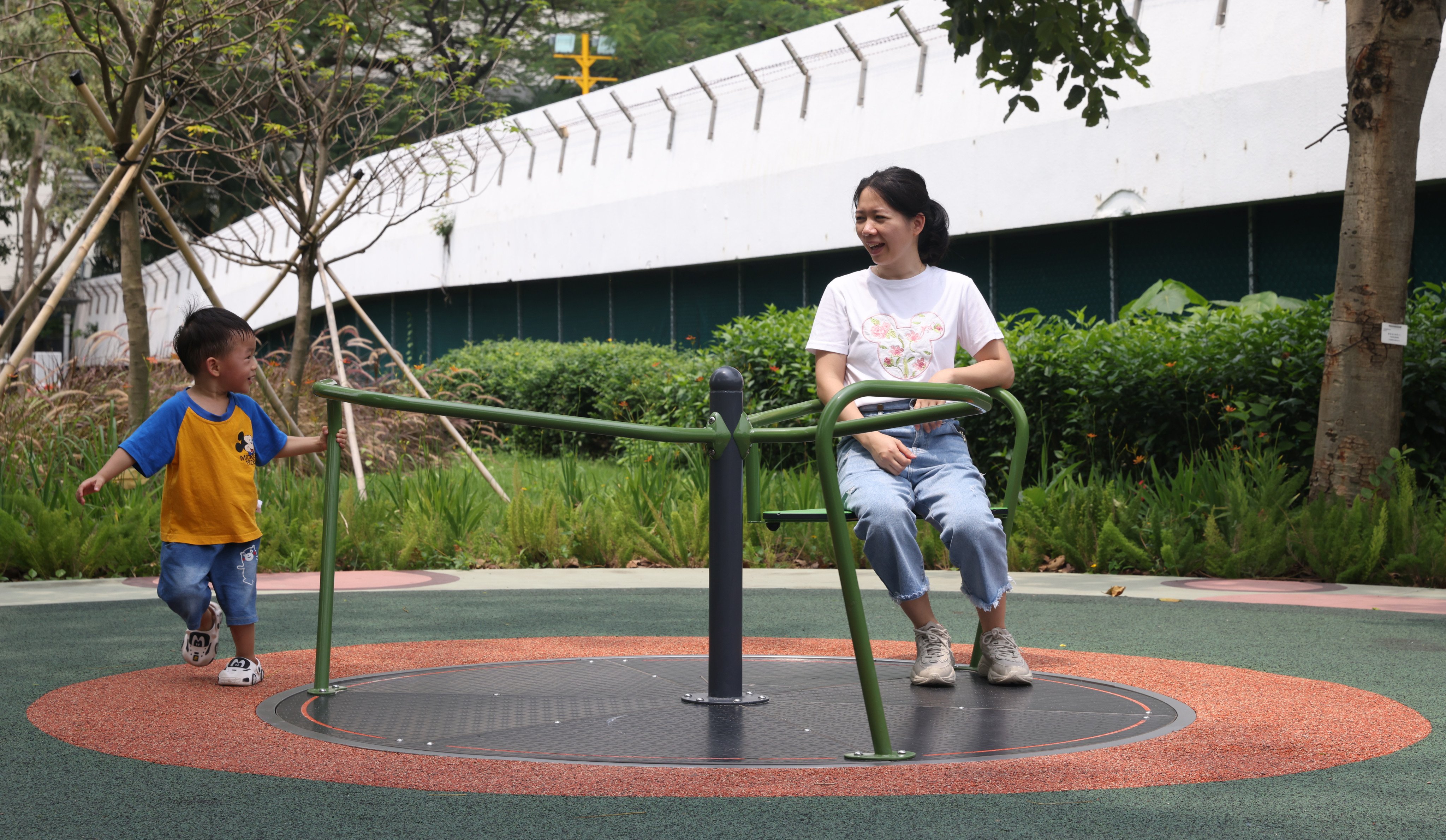 A boy and his mother at a park in Sham Shui Po on May 7. Despite the heavy attention on the deciling birth rate in Hong Kong and many other societies, barriers to motherhood and prejudice against working mothers make having children a difficult choice for many women. Photo: Yik Yeung-man