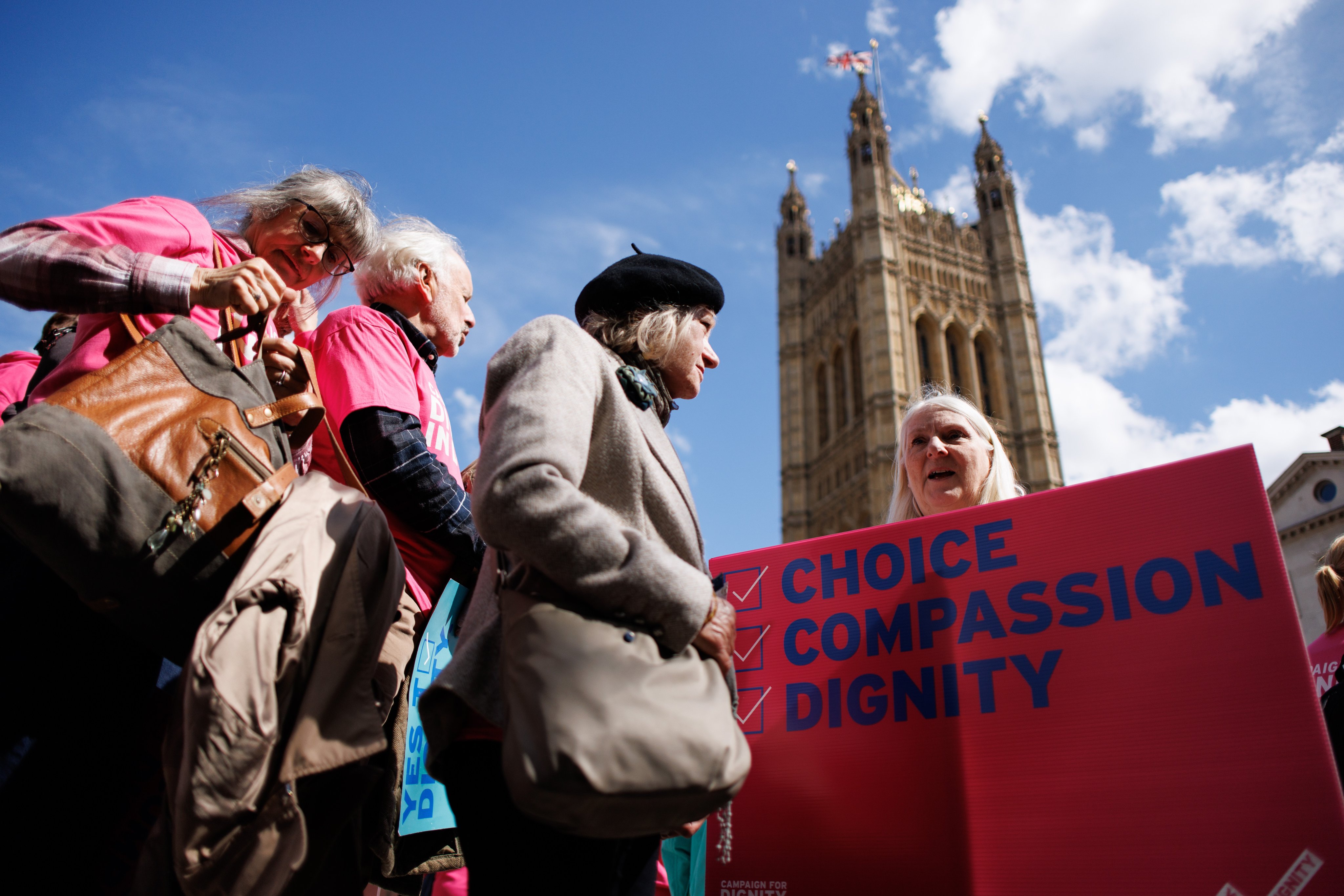 Pro-assisted dying campaigners gather outside the UK Houses of Parliament as MPs prepare to debate over changing the law on assisted dying, in London on April 29. Photo: EPA-EFE