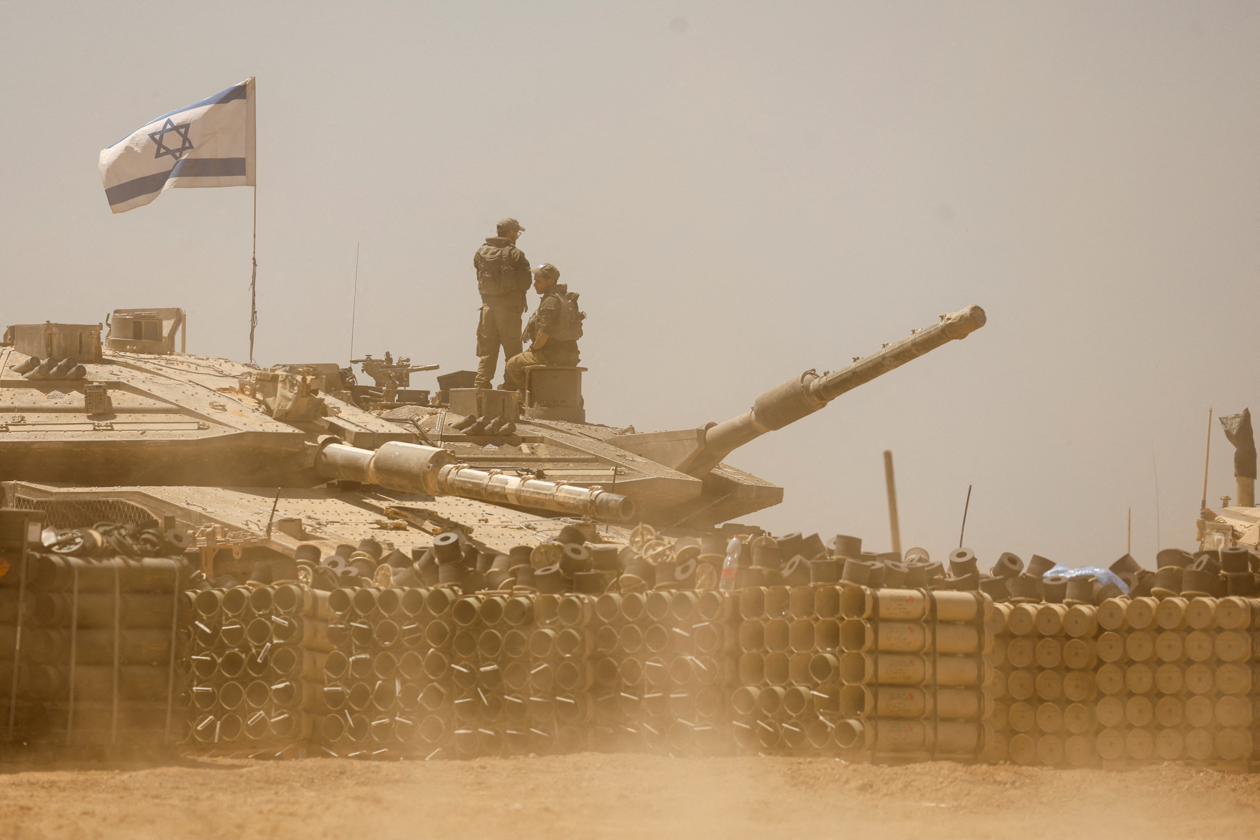 Israeli armoured vehicles are seen near the Gaza border in southern Israel on Thursday. Photo: Reuters