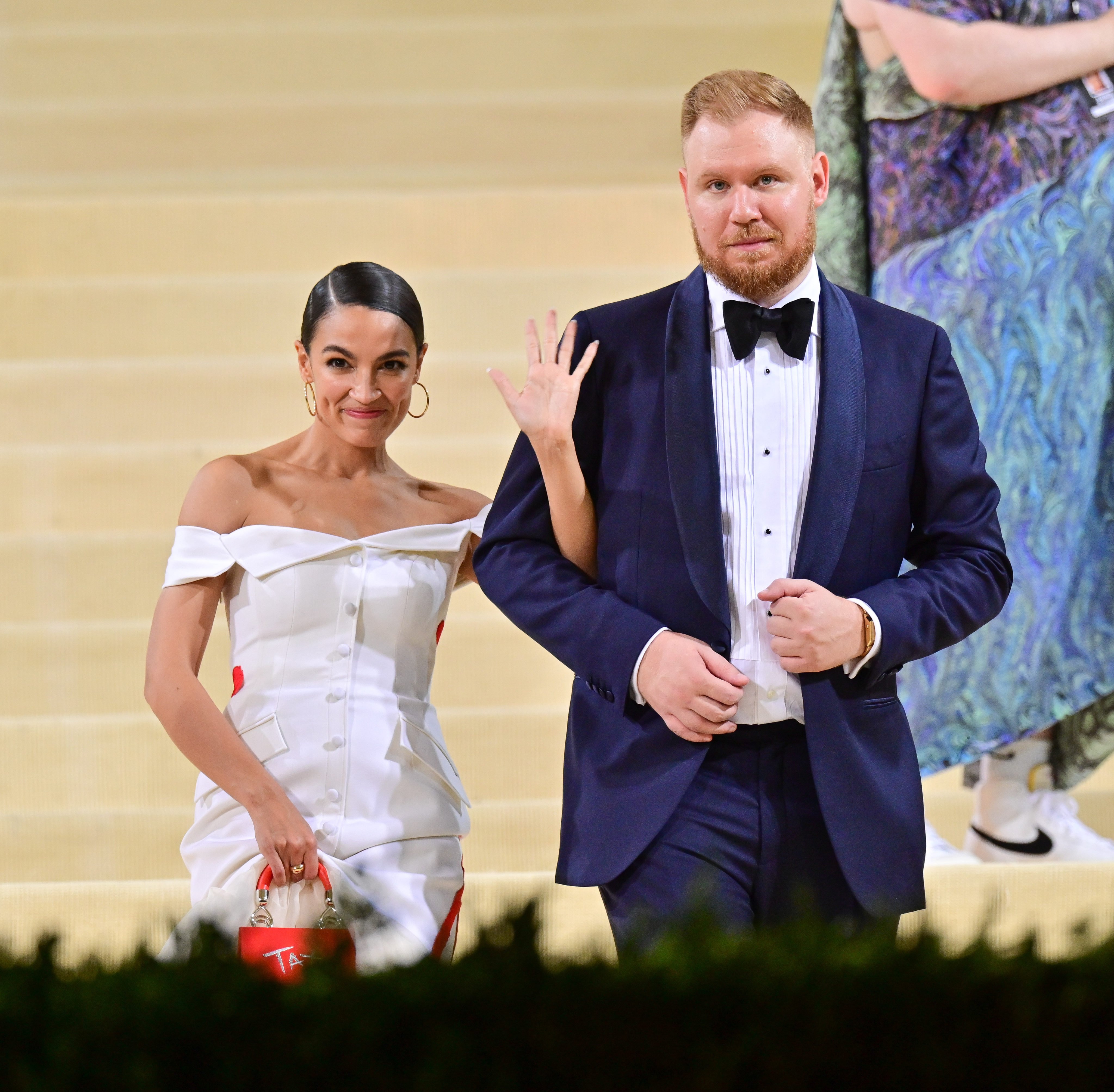 Alexandria Ocasio-Cortez and Riley Roberts leave after the 2021 Met Gala. Photo: Getty Images