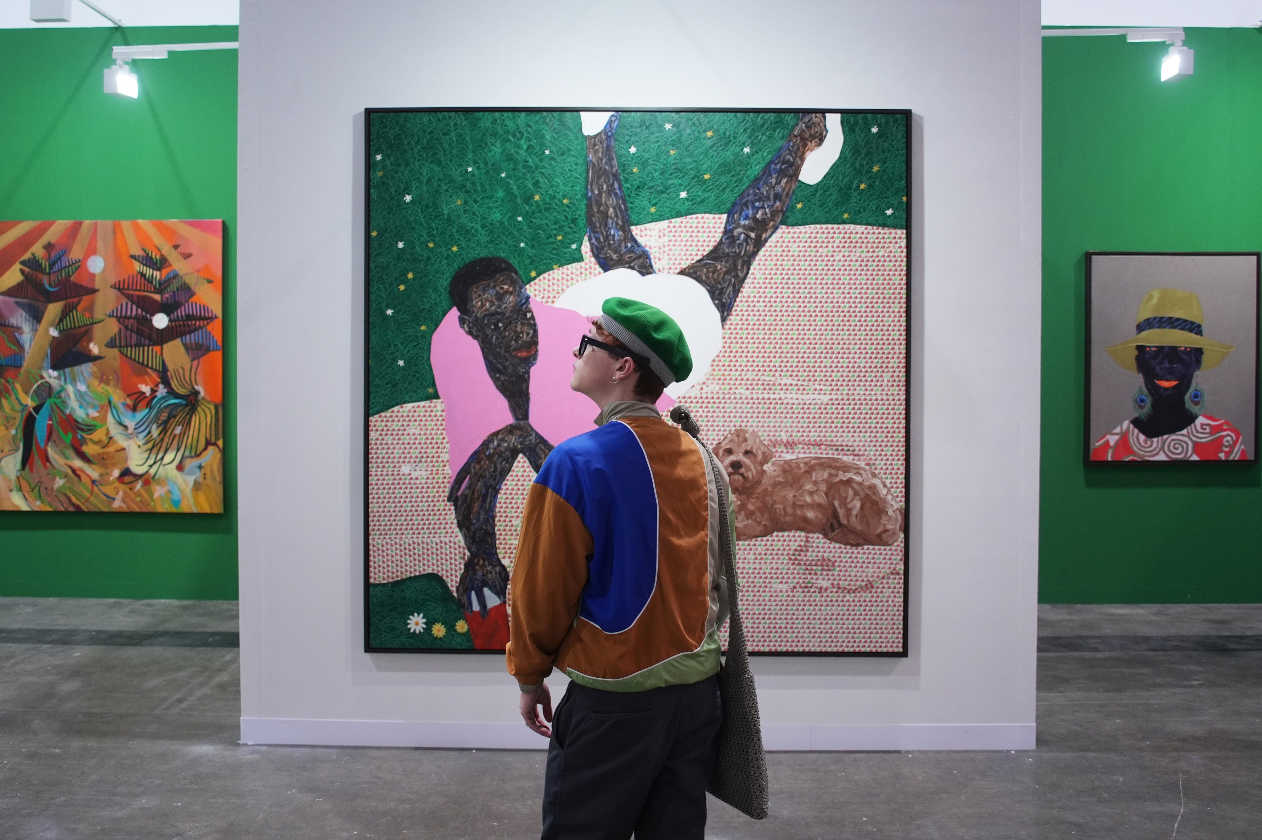 A visitor to Gallery 1957’s booth at this year’s Art Basel Hong Kong, at the Hong Kong Convention and Exhibition Centre in Wan Chai. Photo: Eugene Lee