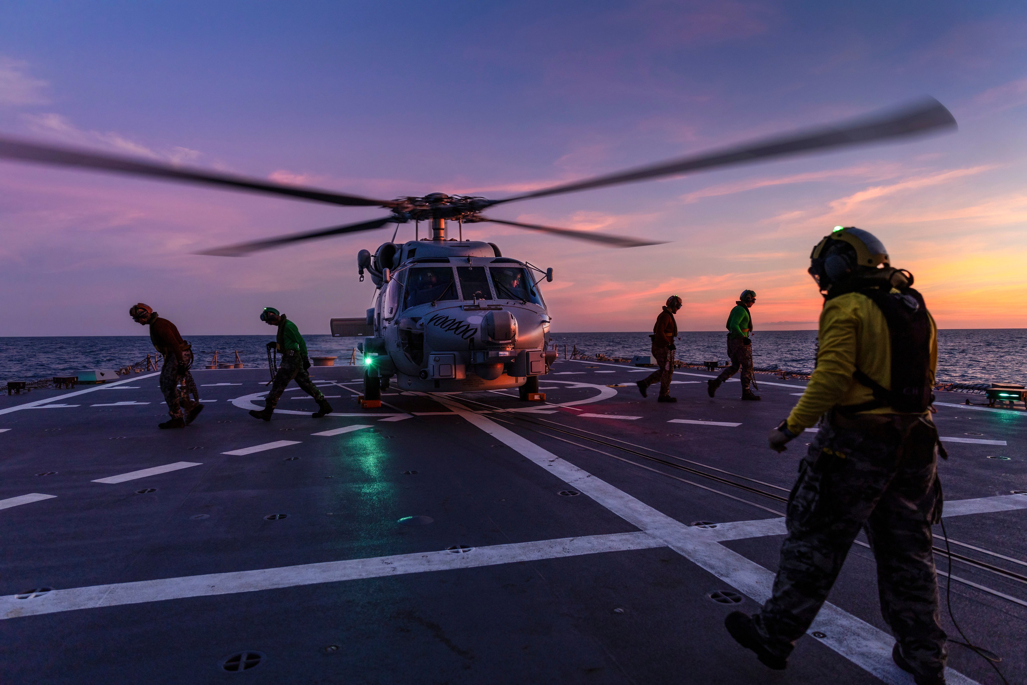 A Seahawk helicopter prepares to take off from the deck of HMAS Hobart during flying operations while on a regional presence deployment off northern Australia. Photo: AP