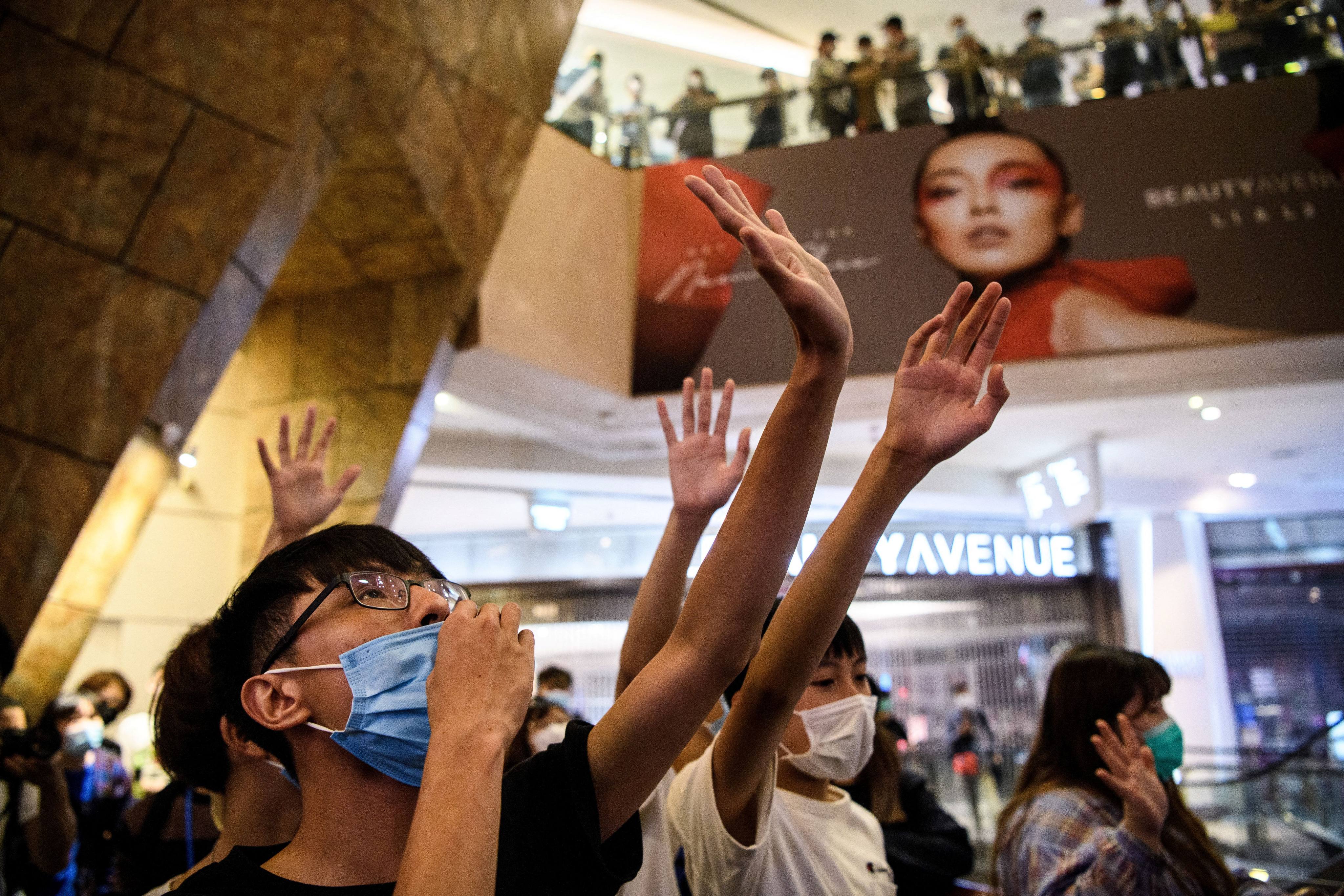 Protesters gather to sing “Glory to Hong Kong” at a shopping mall during the 2019 anti-government demonstrations. Photo: AFP