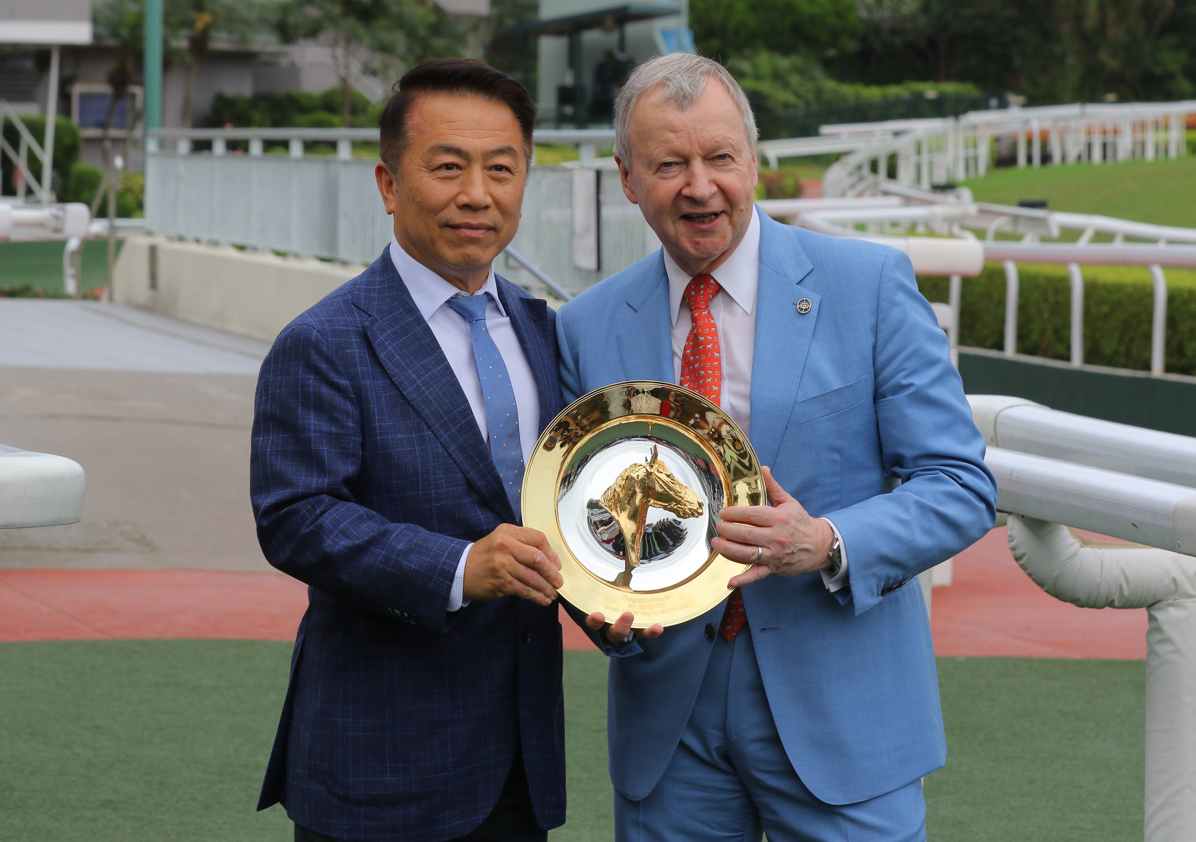 Ricky Yiu celebrates his 1,000th win with Jockey Club CEO Winfried Engelbrecht-Bresges. Photos: Kenneth Chan