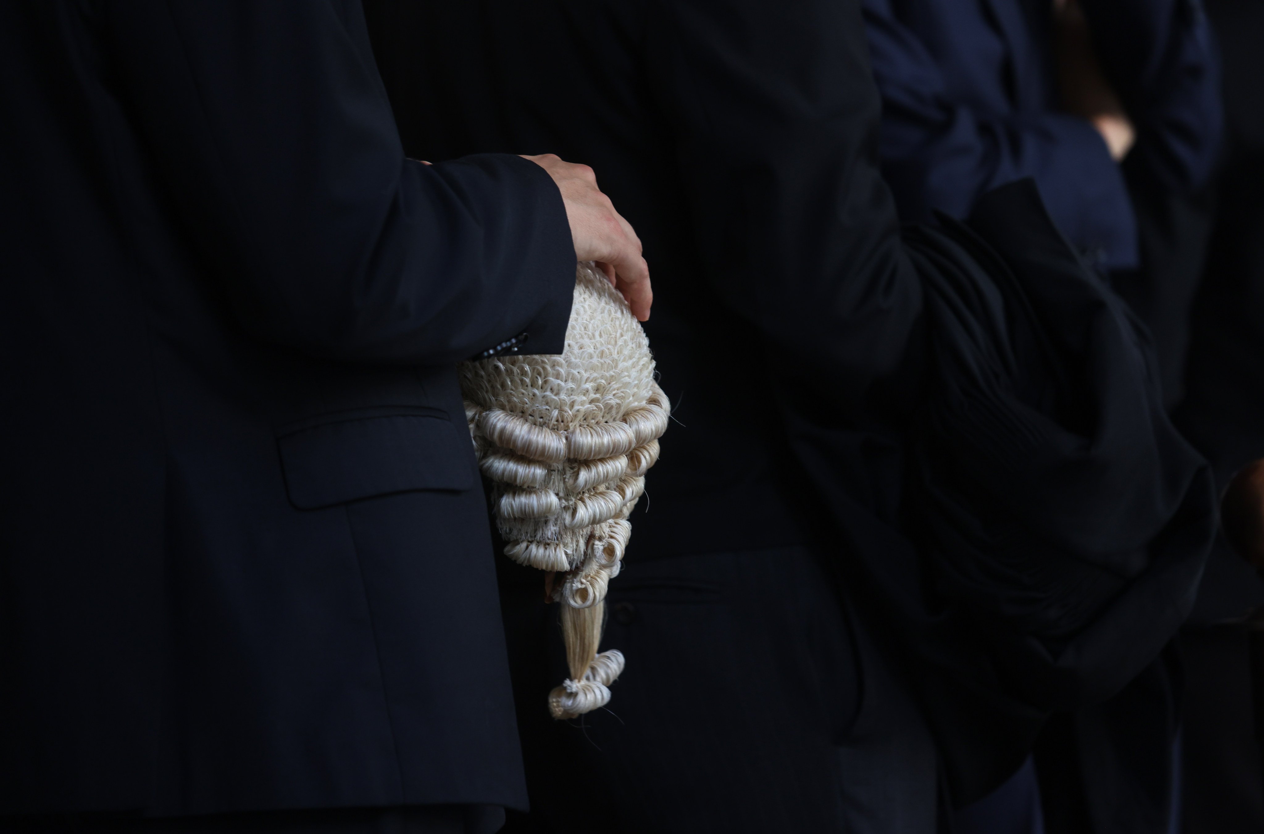 A barrister holds a wig during the senior counsel appointment ceremony in Central. Photo: Yik Yeung-man.