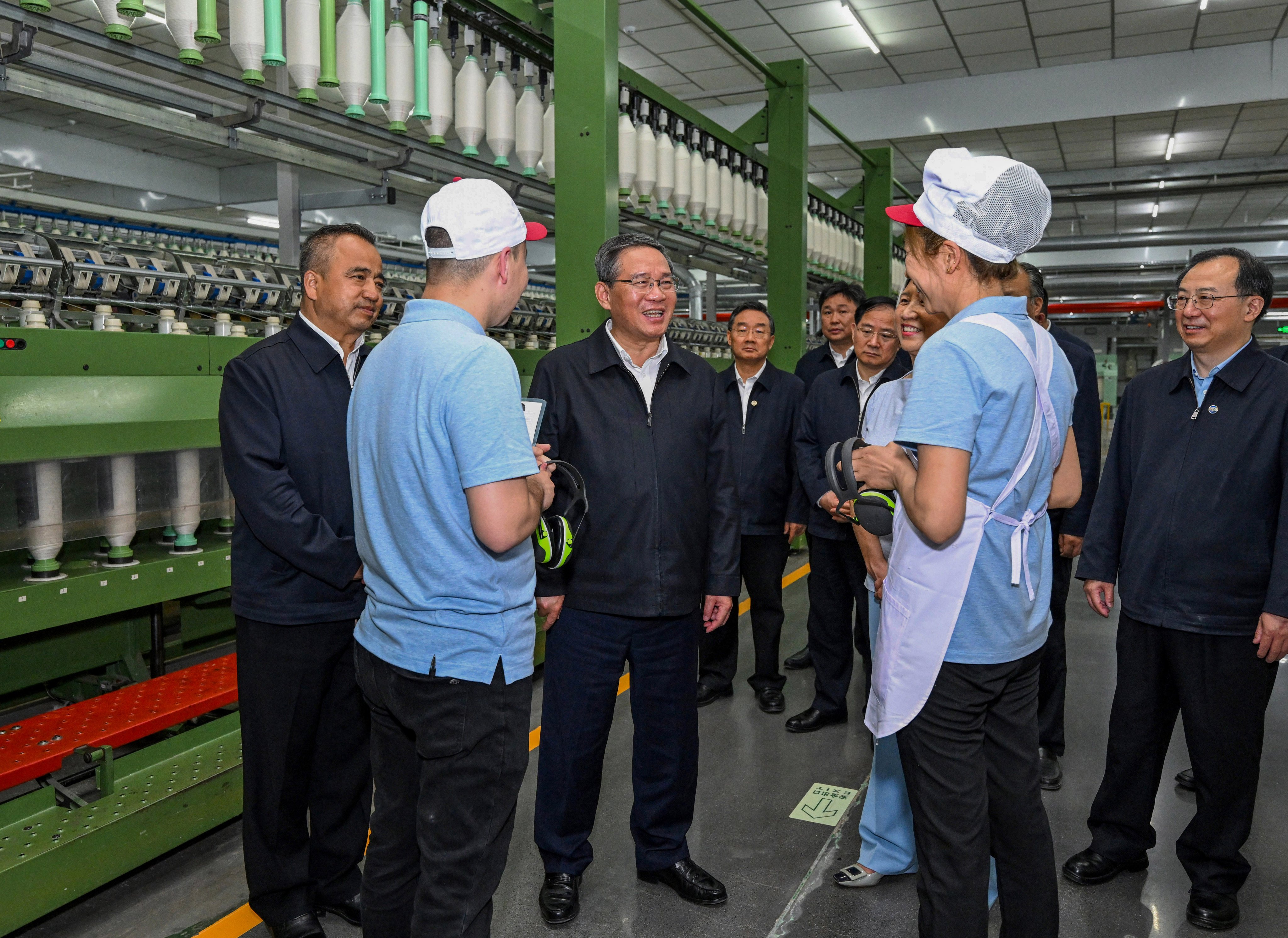 Chinese Premier Li Qiang visits a local company during his tour of Xinjiang. Photo: Xinhua