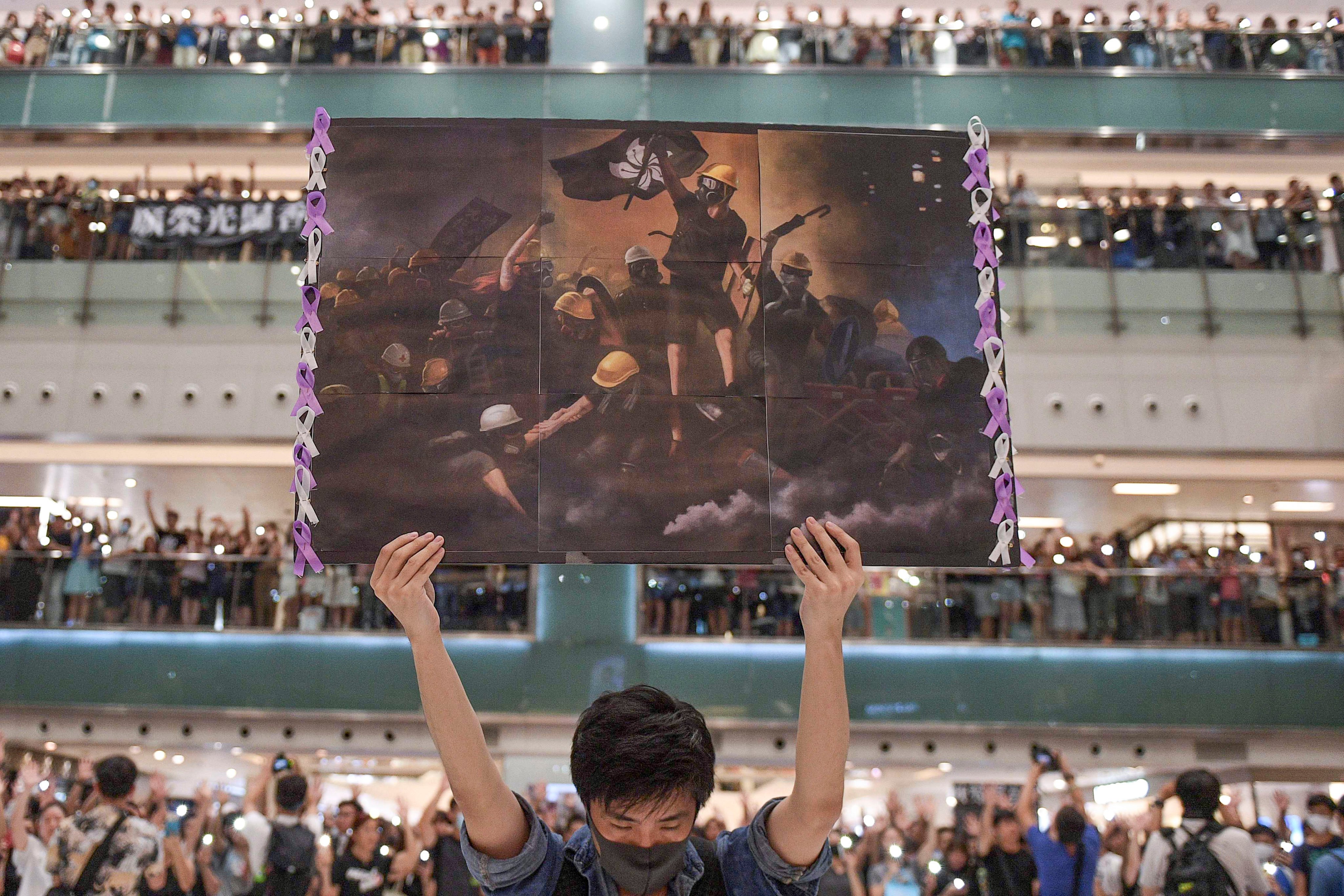 Protesters at a shopping mall in 2019 singing the protest song ‘Glory to Hong Kong’. Photo: AFP