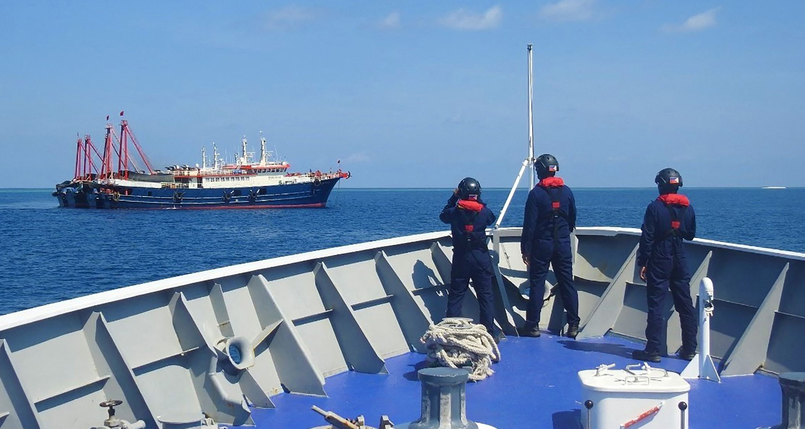 Philippine coastguard personnel aboard their ship BRP Cabra in 2021 monitoring Chinese vessels anchored at Sabina Shoal, a South China Sea outcrop claimed by Manila. Photo: Handout / Philippine Coast Guard / AFP