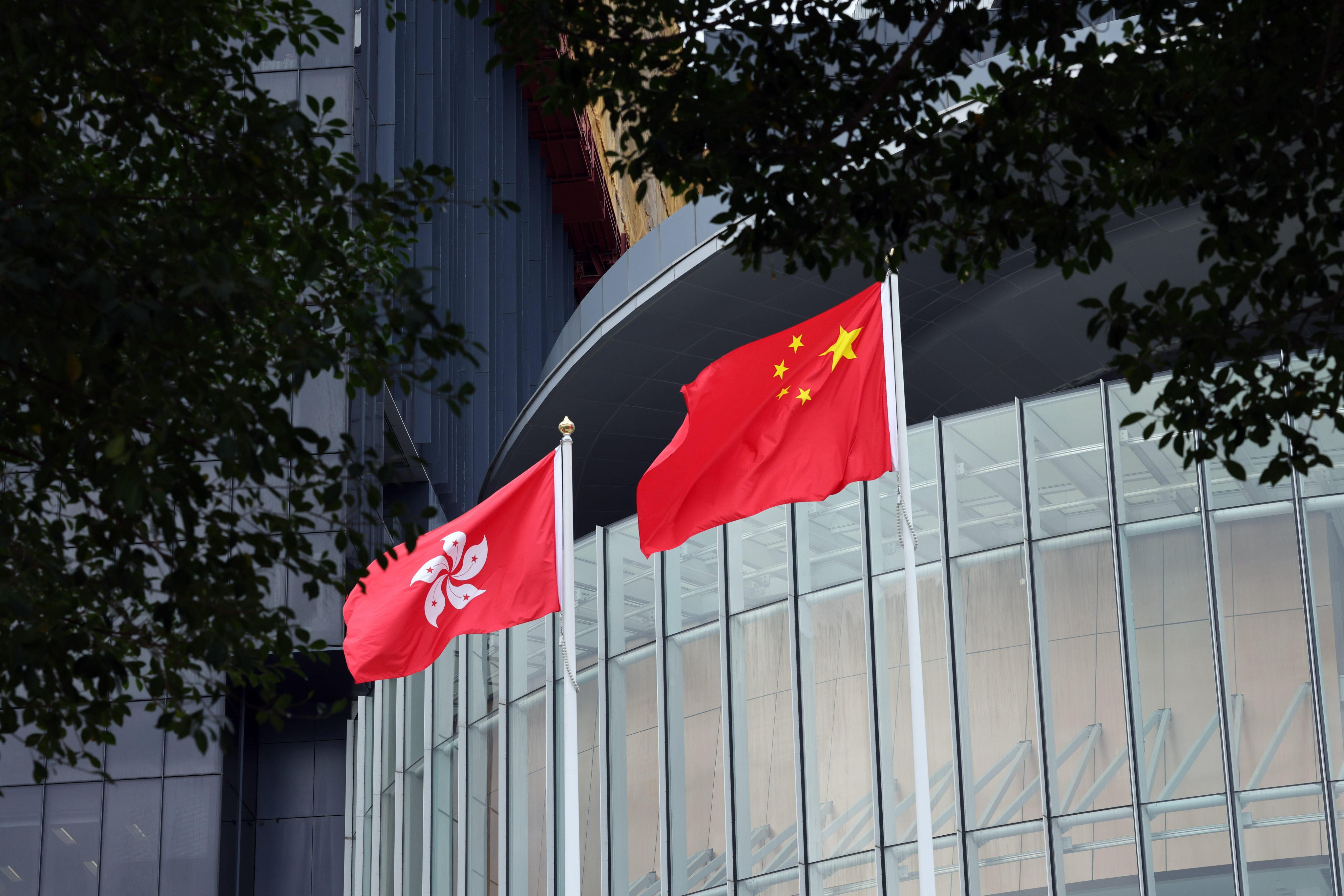 The Hong Kong and national flags at the legislature at Tamar. The Xinhua commentary came after the US Congressional-Executive Commission on China issued its 2023 Annual Report. Photo: Jelly Tse