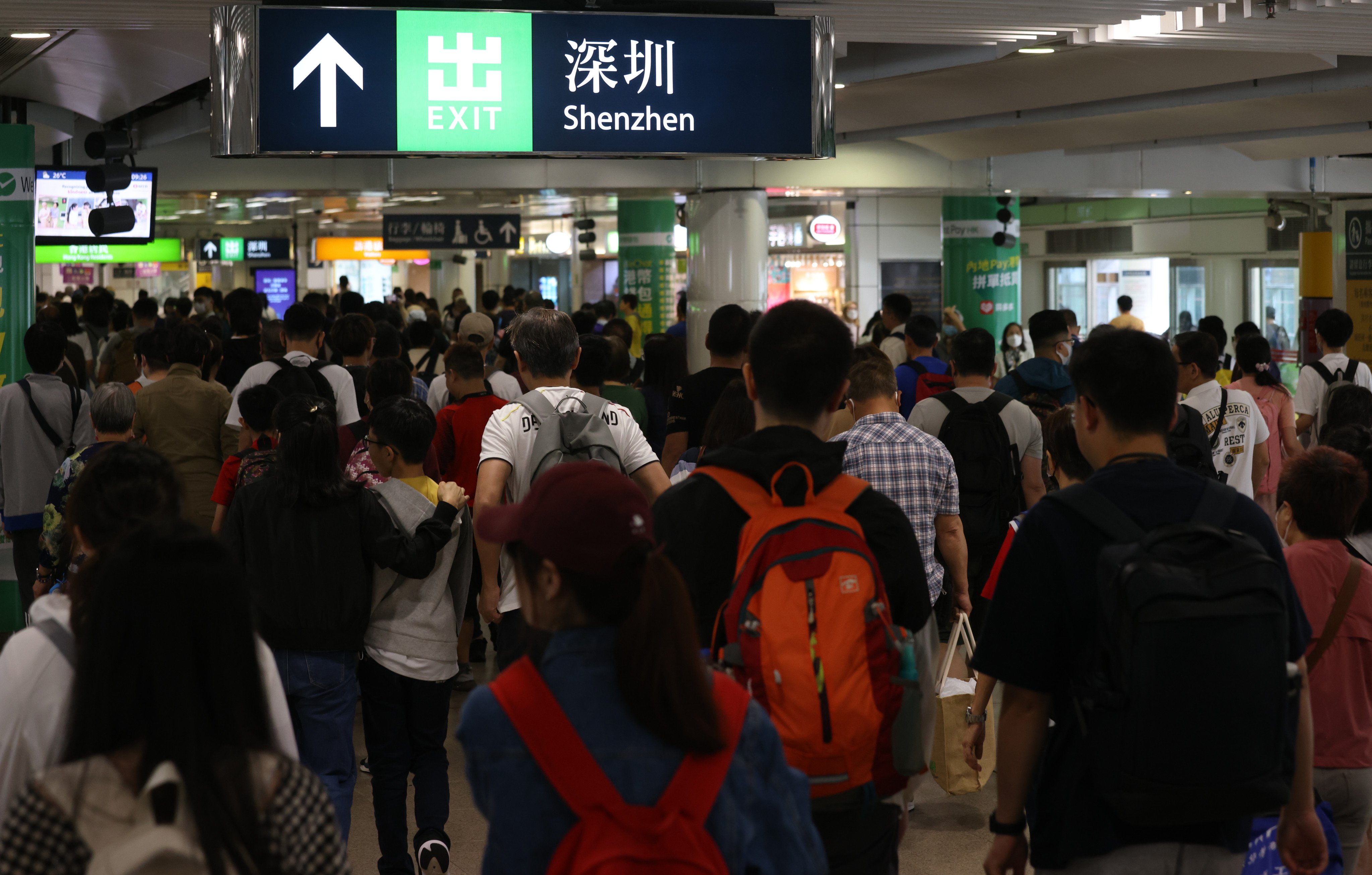 Travellers at the Lo Wu control point in Hong Kong head to Shenzhen during a recent holiday. Photo: Yik Yeung-man
