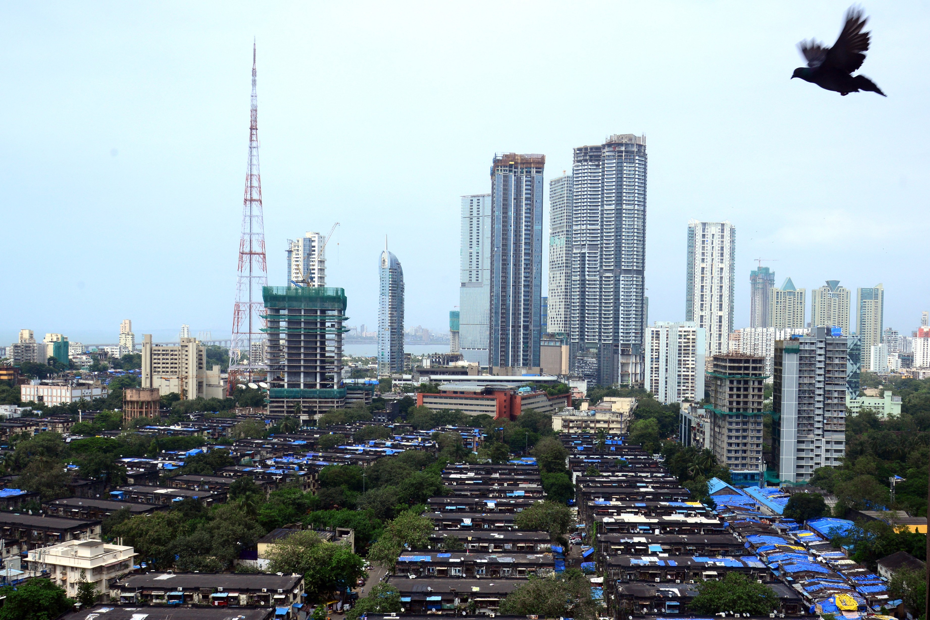 A bird’s eye view of Mumbai shows affordable workers’ accommodation in front of high-rise residential towers. Photo: AFP